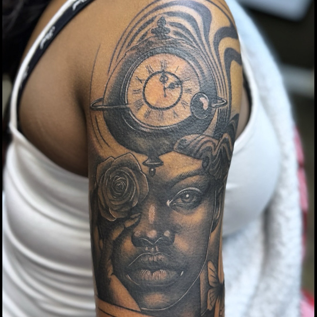 Portrait with celestial elements realism tattoo on the shoulder by Anwon Johnson