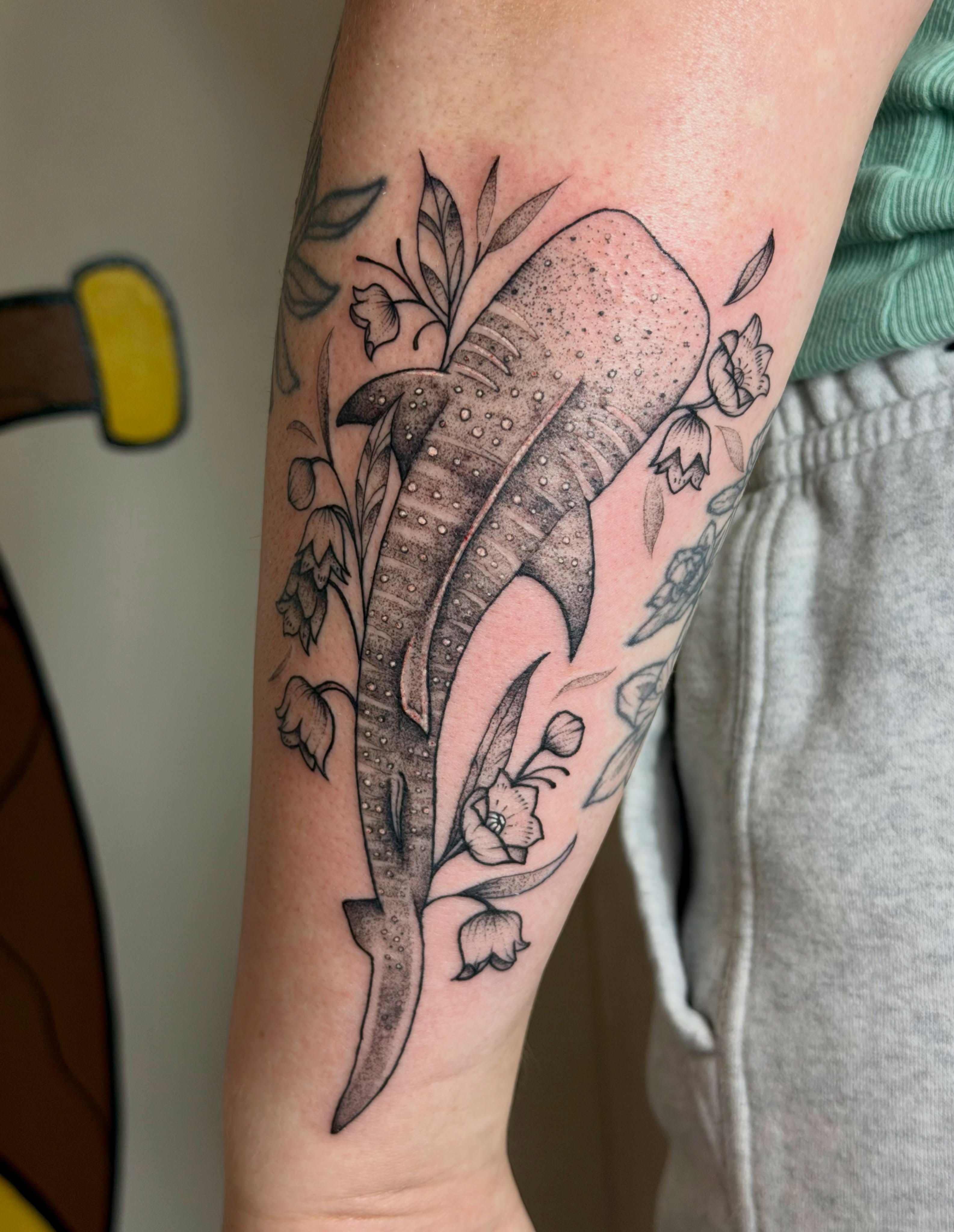 Whale shark with flowers dotwork tattoo on the forearm by Sophia, New Carlisle, Ohio