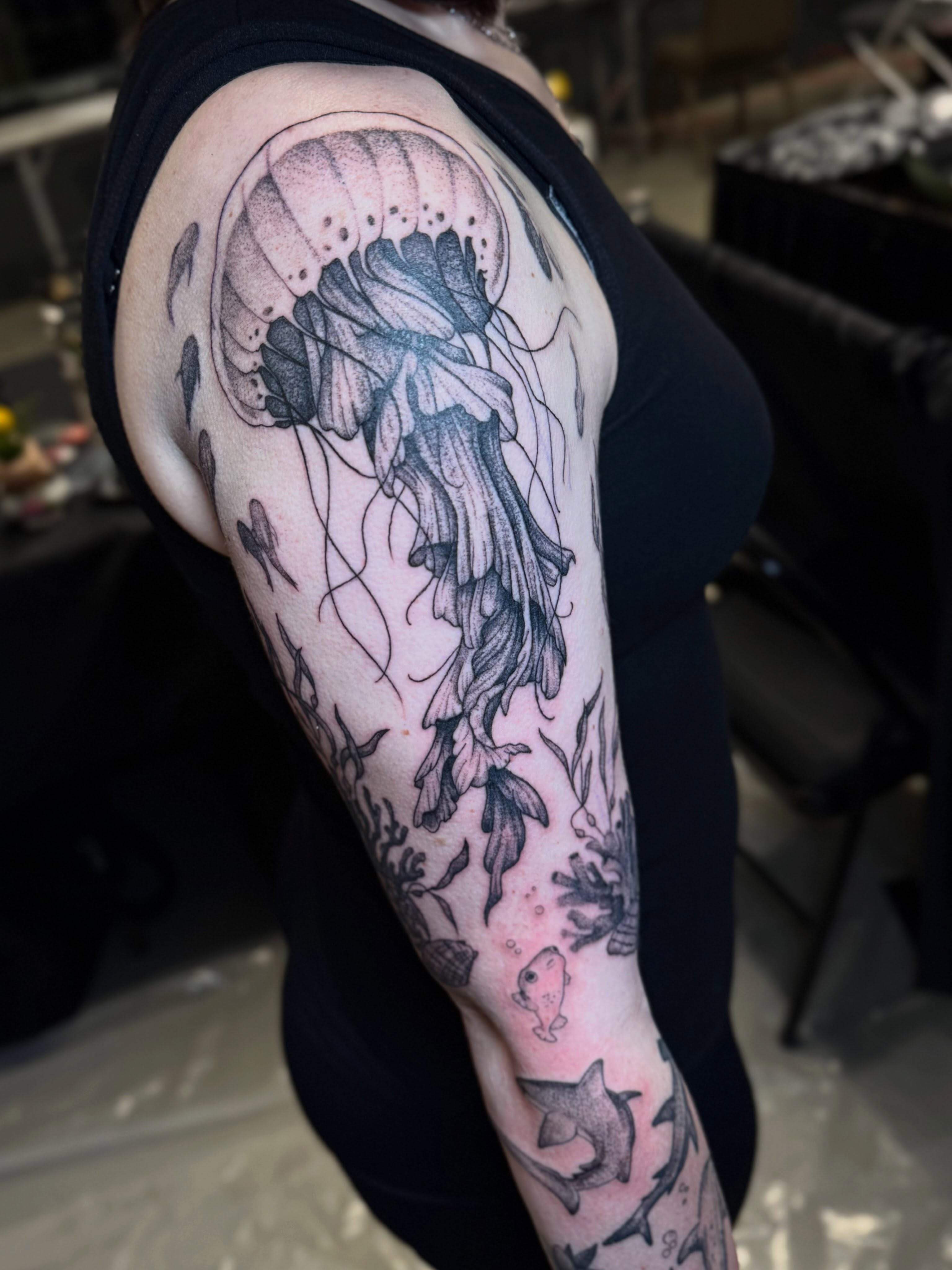 Jellyfish black and grey tattoo on the upper arm by βπ¬π―π’πΆ