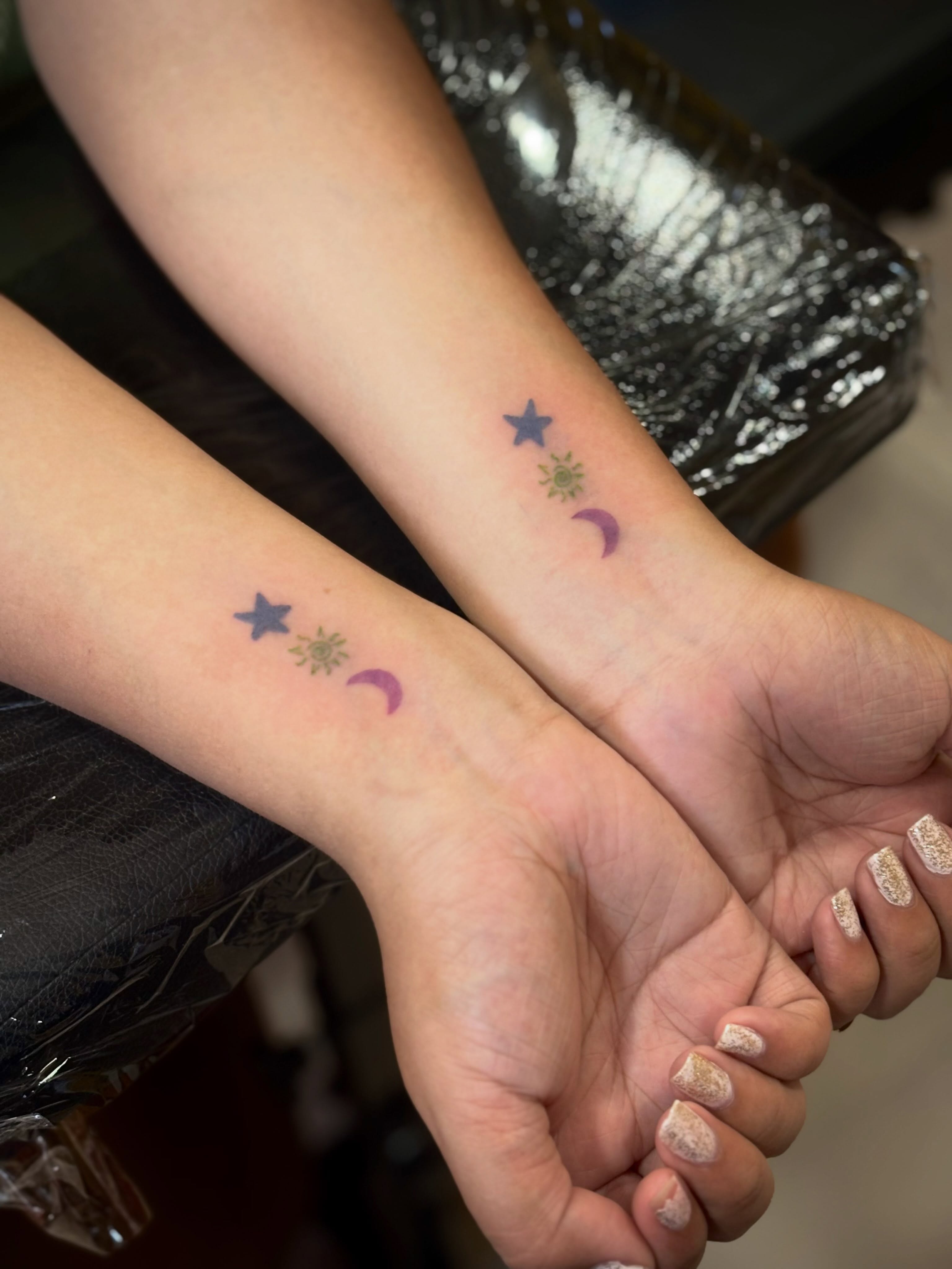 Stars and crescent moon dotwork tattoo on the forearm by Jazzlyn Hous