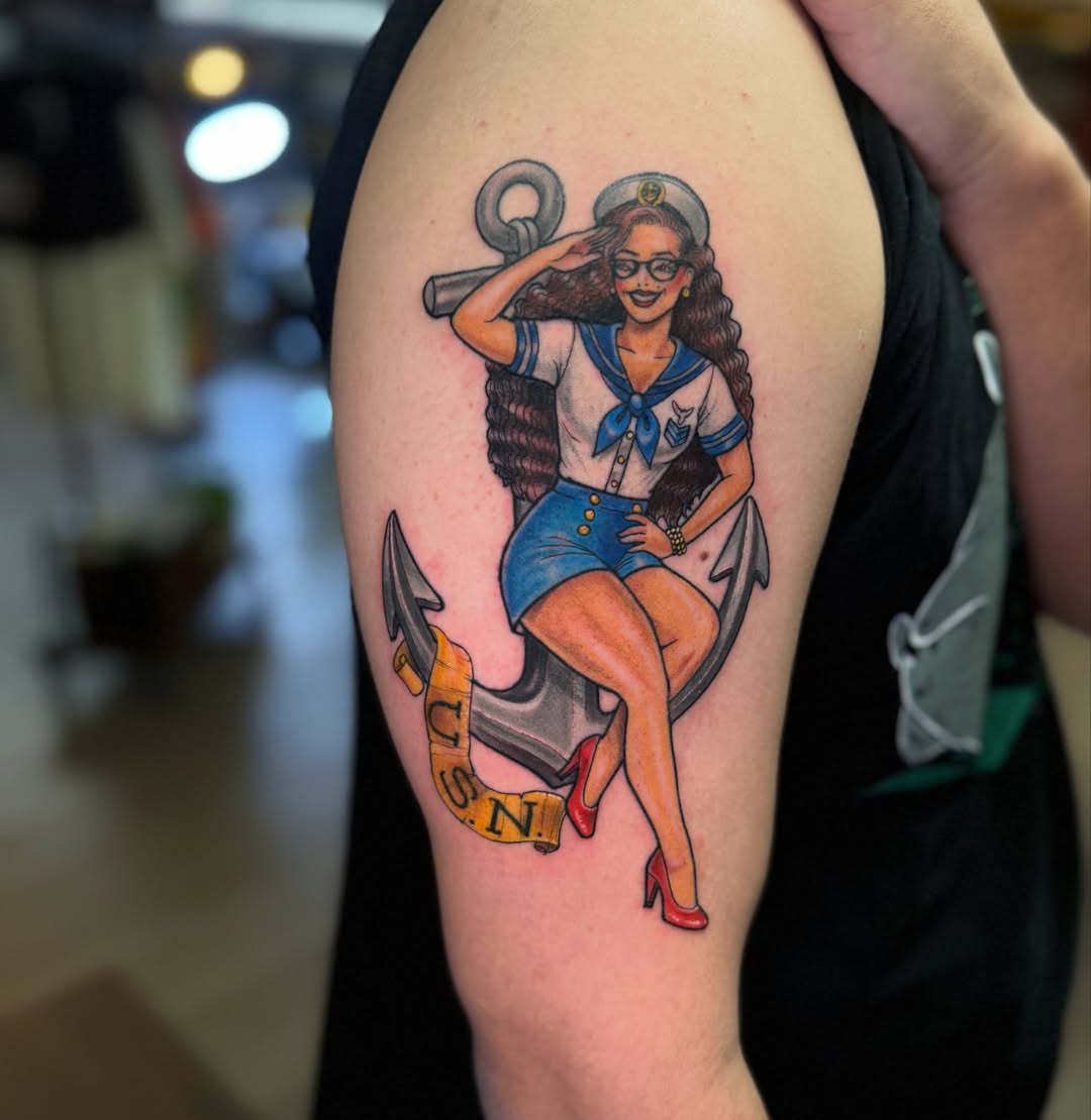 Nautical pin-up girl American traditional tattoo on the upper arm by ๐ต๐๐๐ ๐ฐ๐๐๐