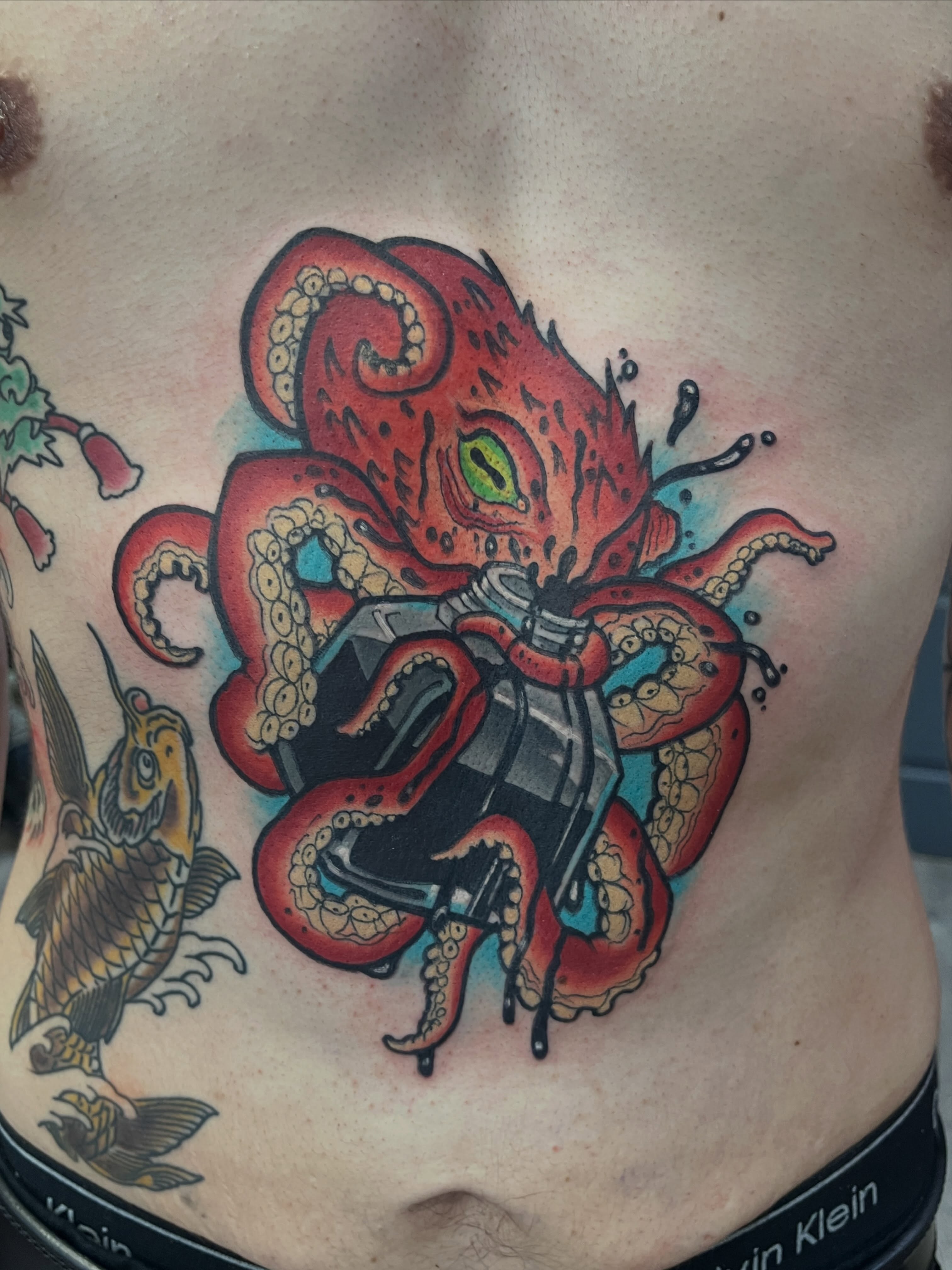 Octopus American traditional tattoo on the chest by Miles Maniaci, Chicago, Illinois