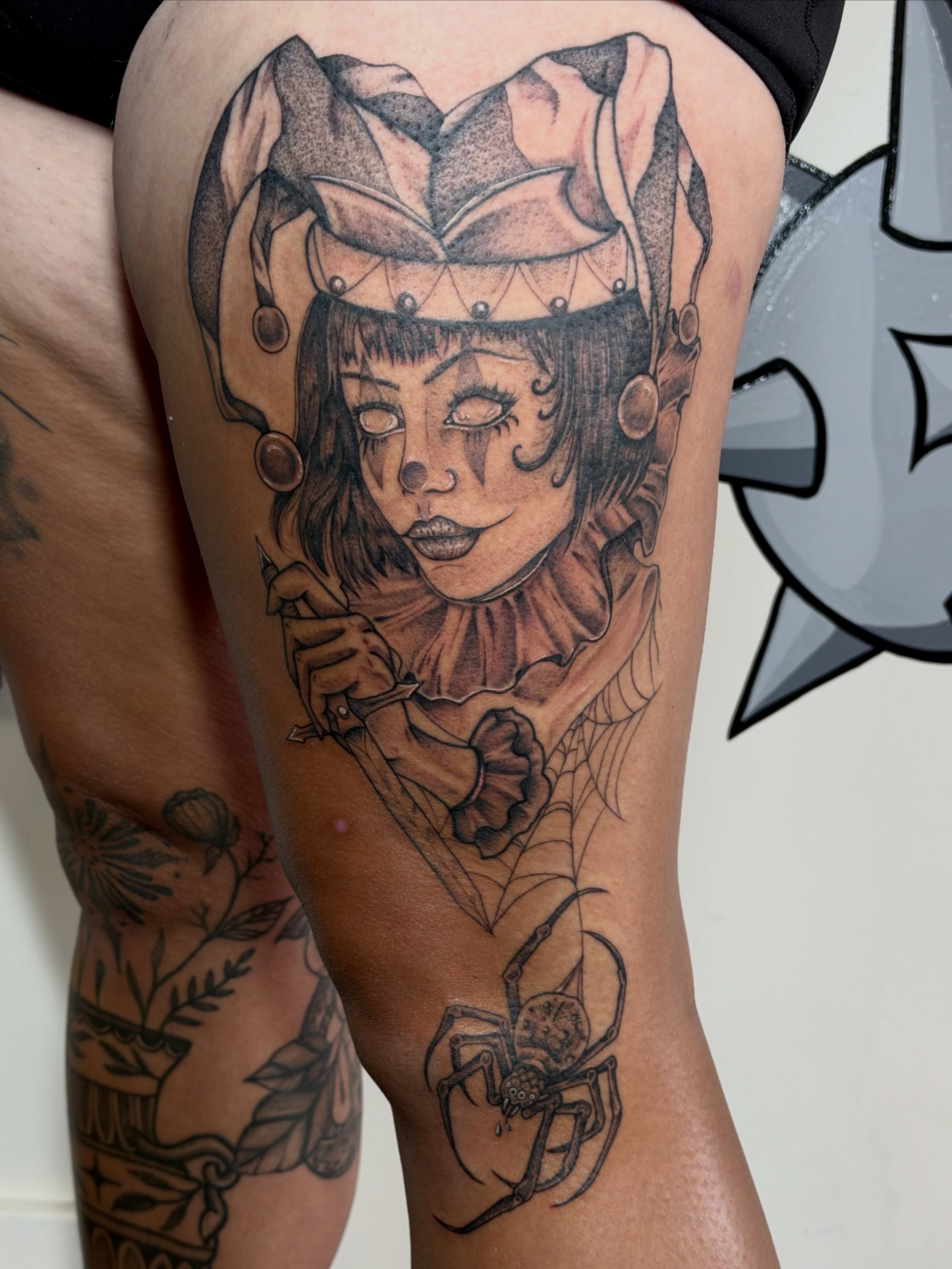 Clown realism tattoo on the thigh by Sophia, New Carlisle, Ohio