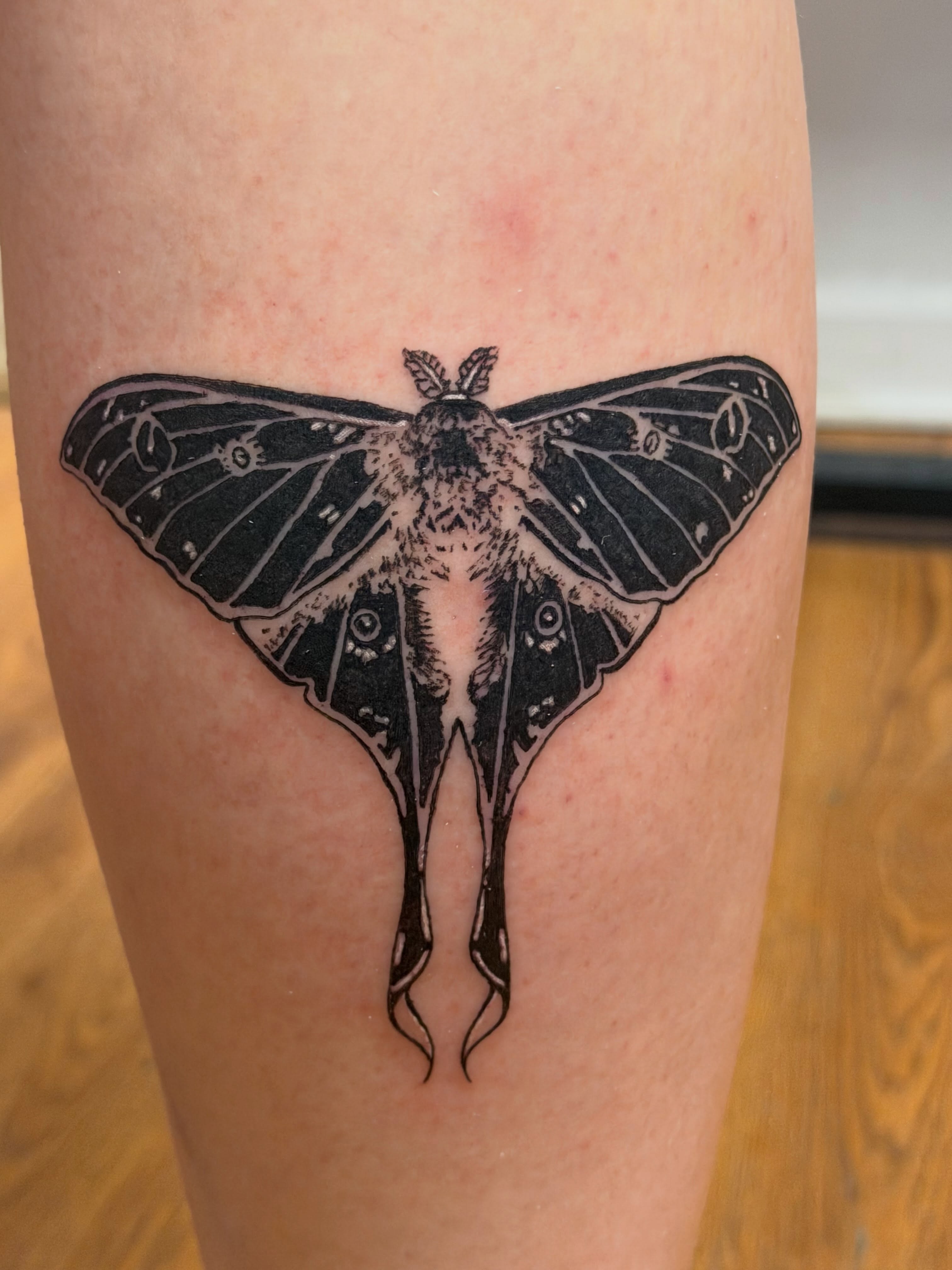 Moth black and grey tattoo on the thigh by Rebecca (Becca) Ray