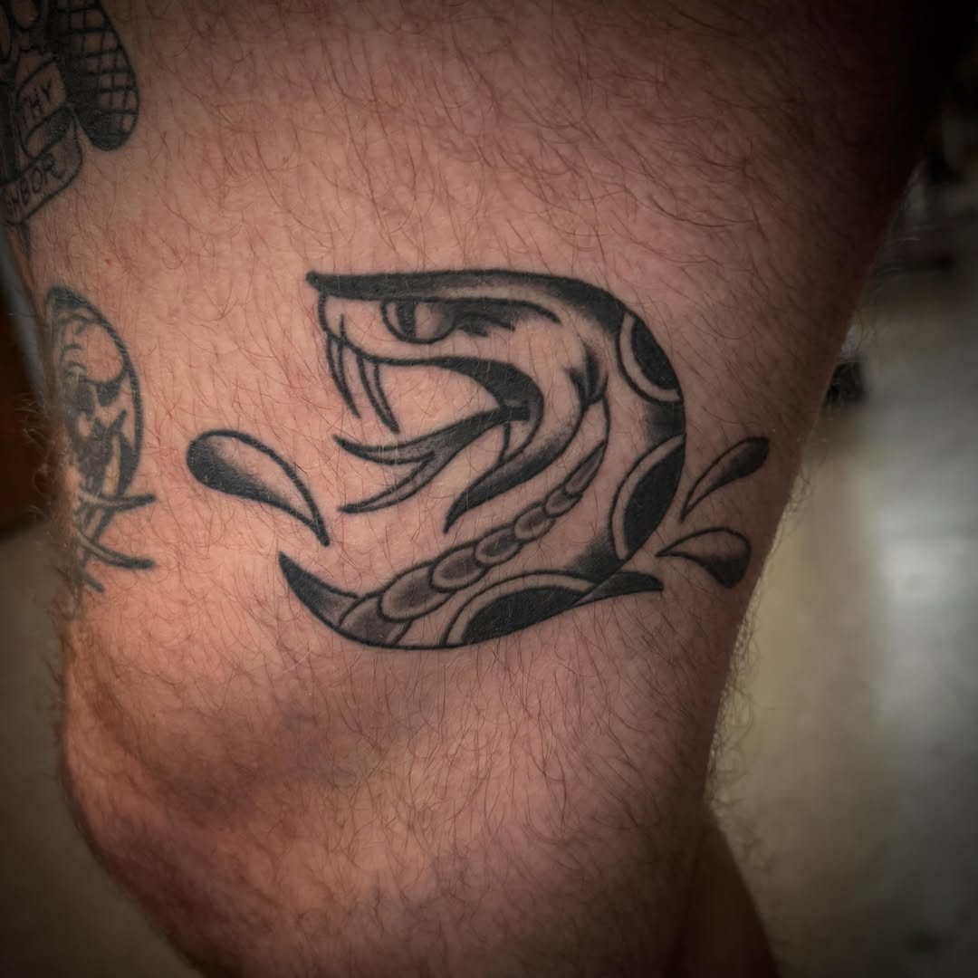 Snake black and grey tattoo on the thigh by ArJay Smith