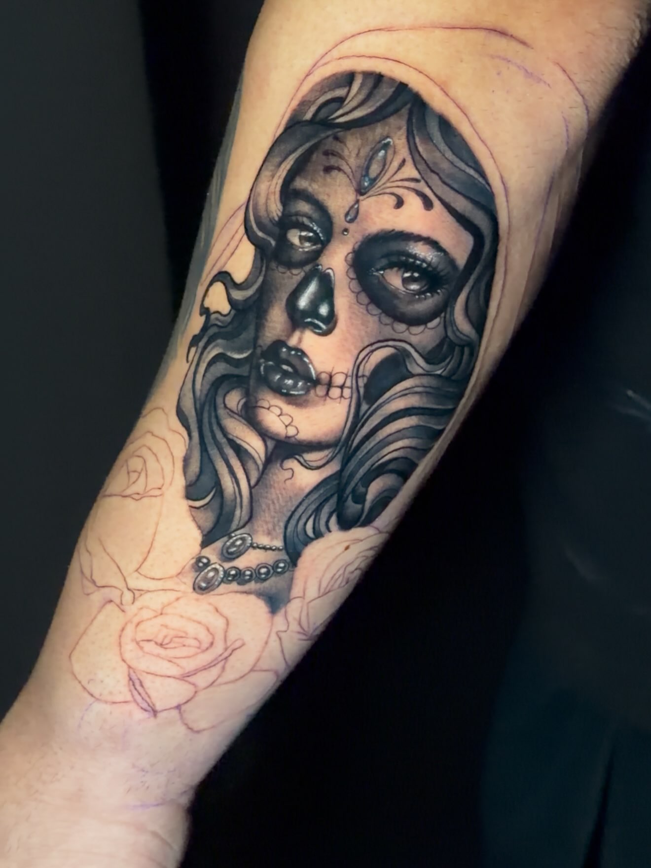 Sugar skull woman realism tattoo on the forearm by Matthew Arguello