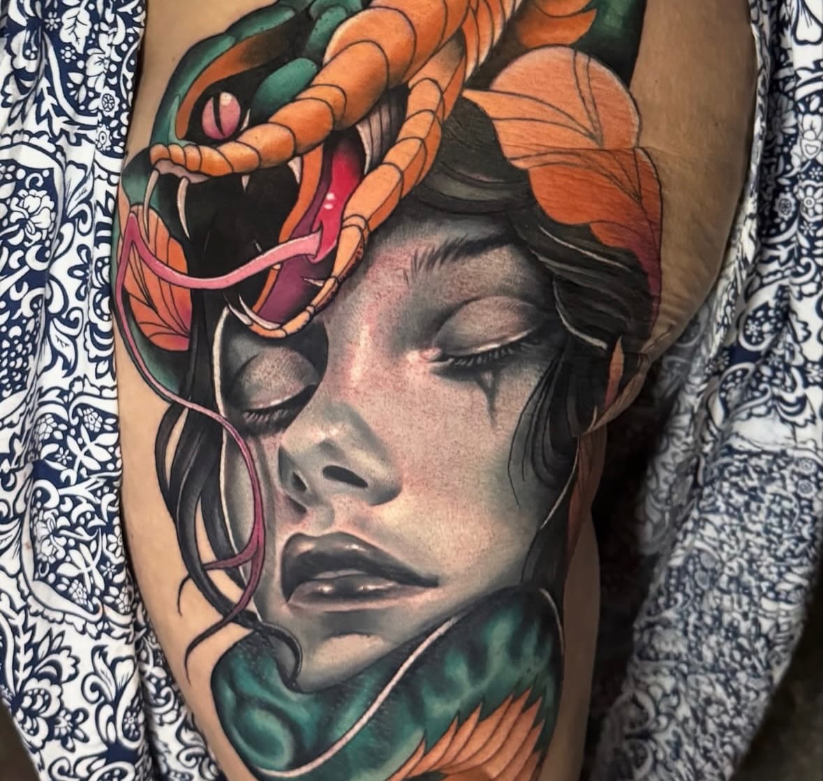 Woman with snakes realism tattoo on the thigh by Dustin Kaiser, Mentor, Ohio