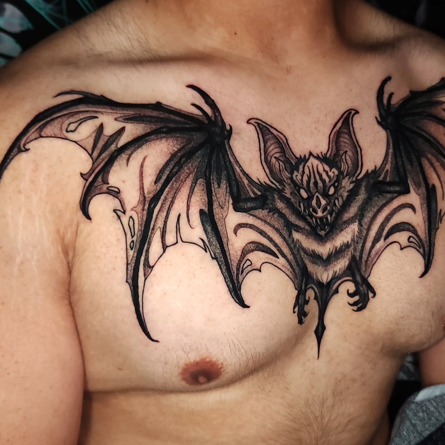 Bat black and grey tattoo on the chest by Mario Romero