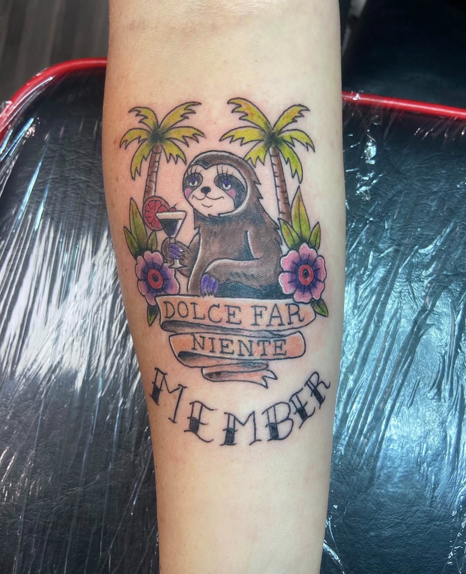 Sloth with drink American traditional tattoo on the forearm by Mike Berry