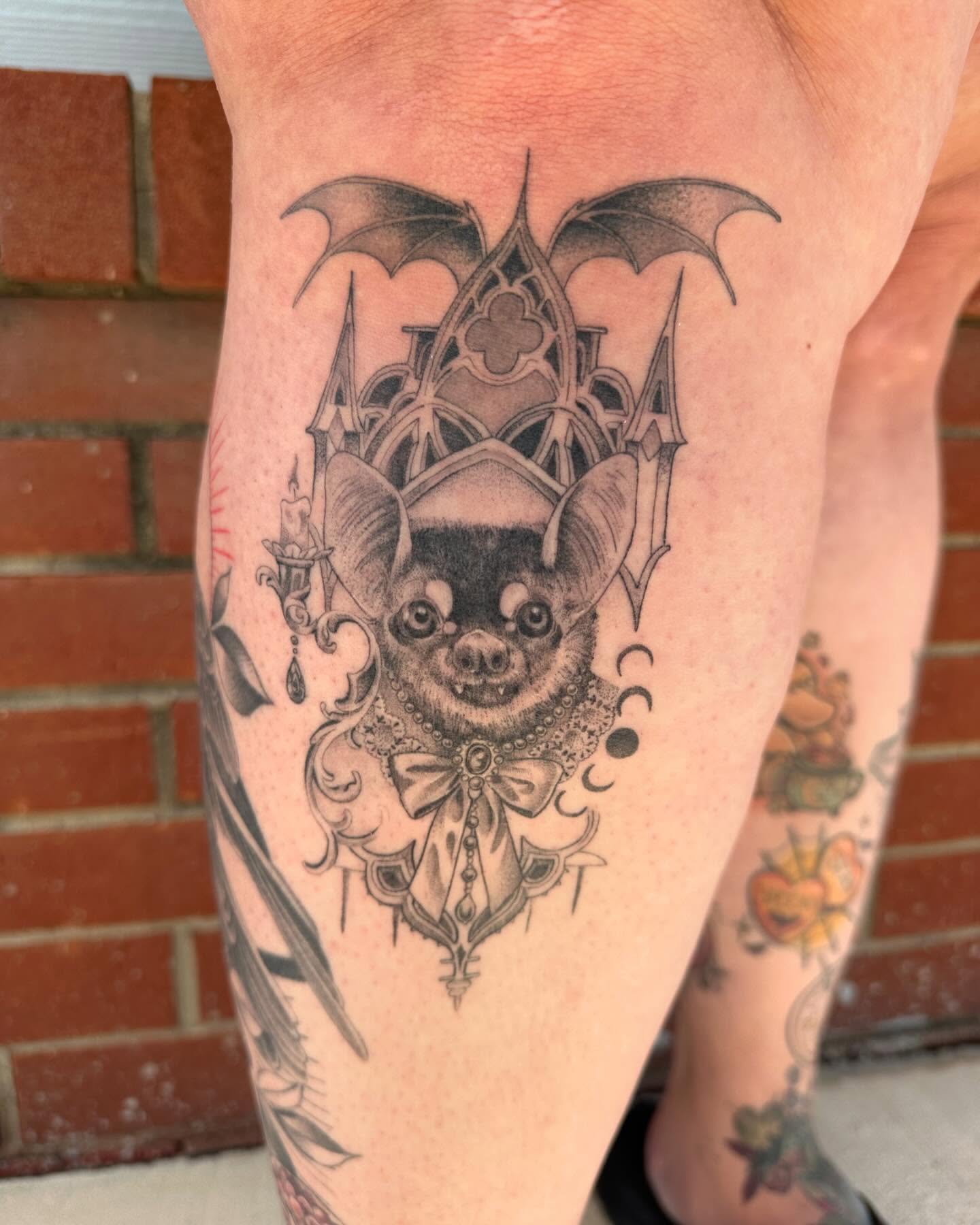 Bat ornamental tattoo on the thigh by Cassandra Rasper-Beard