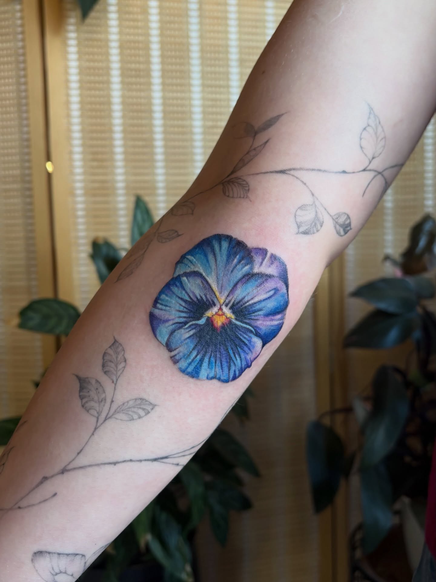 Blue pansy realism tattoo on the forearm by emery ♡ slc utah tattoo artist