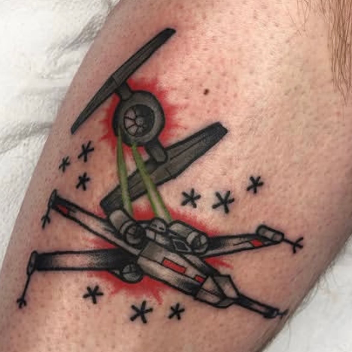 X-wing and Tie Fighter American traditional tattoo on the forearm by Francis Kane