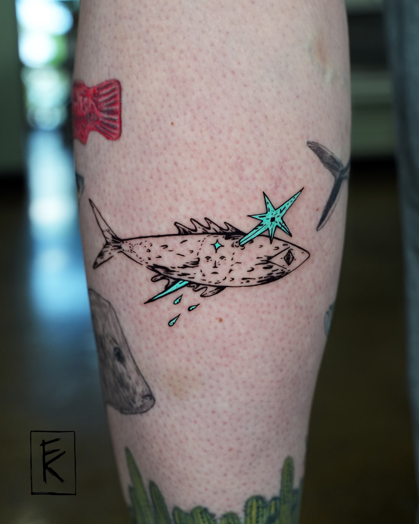 Fish with star dotwork tattoo on the forearm by elizaveta