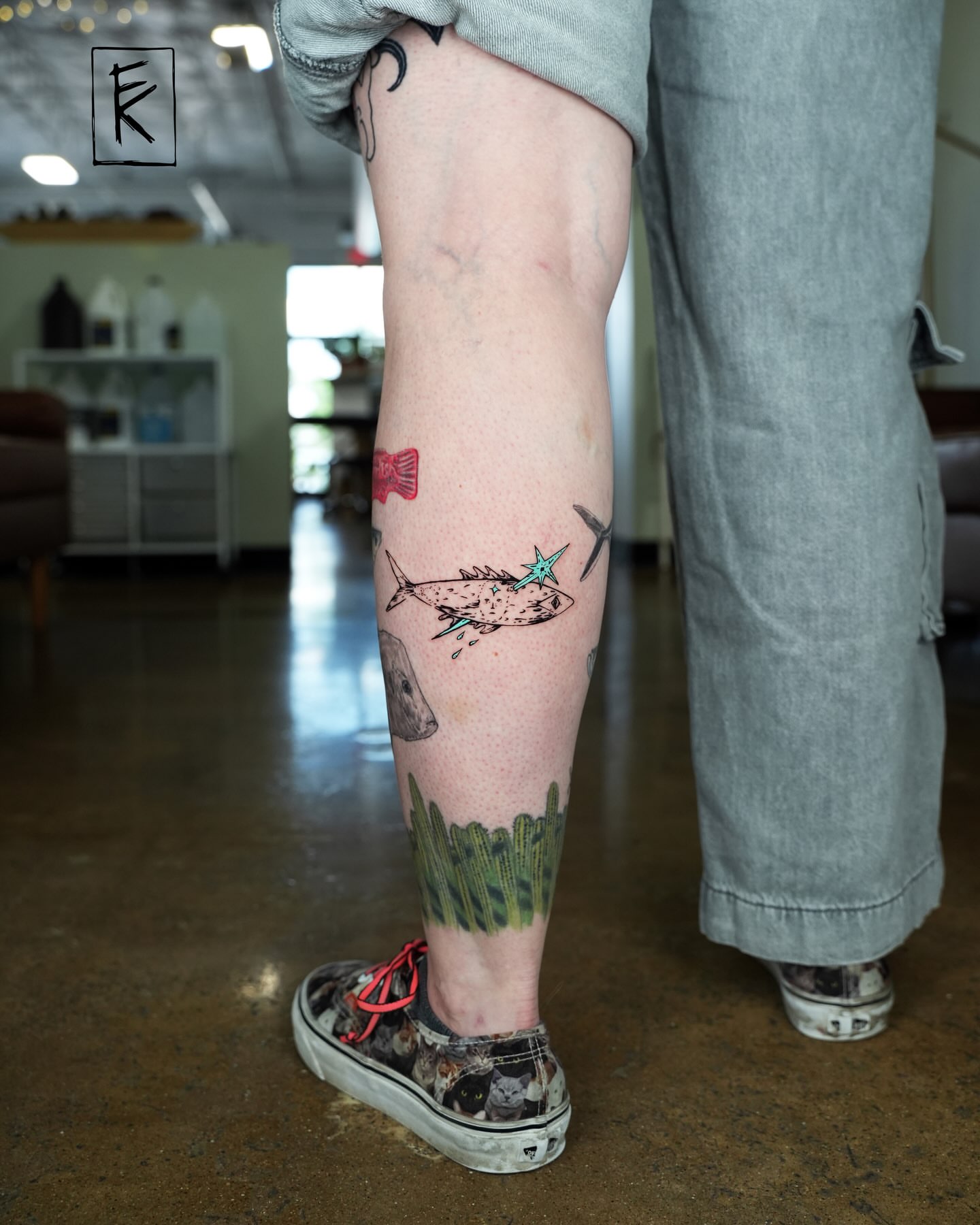 Fish and cactus realism tattoo on the leg by elizaveta
