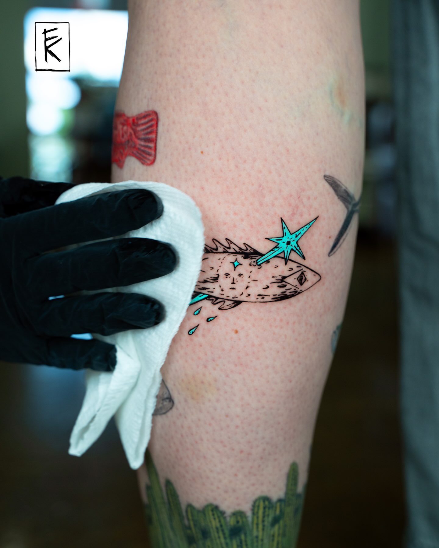 Fish with star dotwork tattoo on the forearm by elizaveta