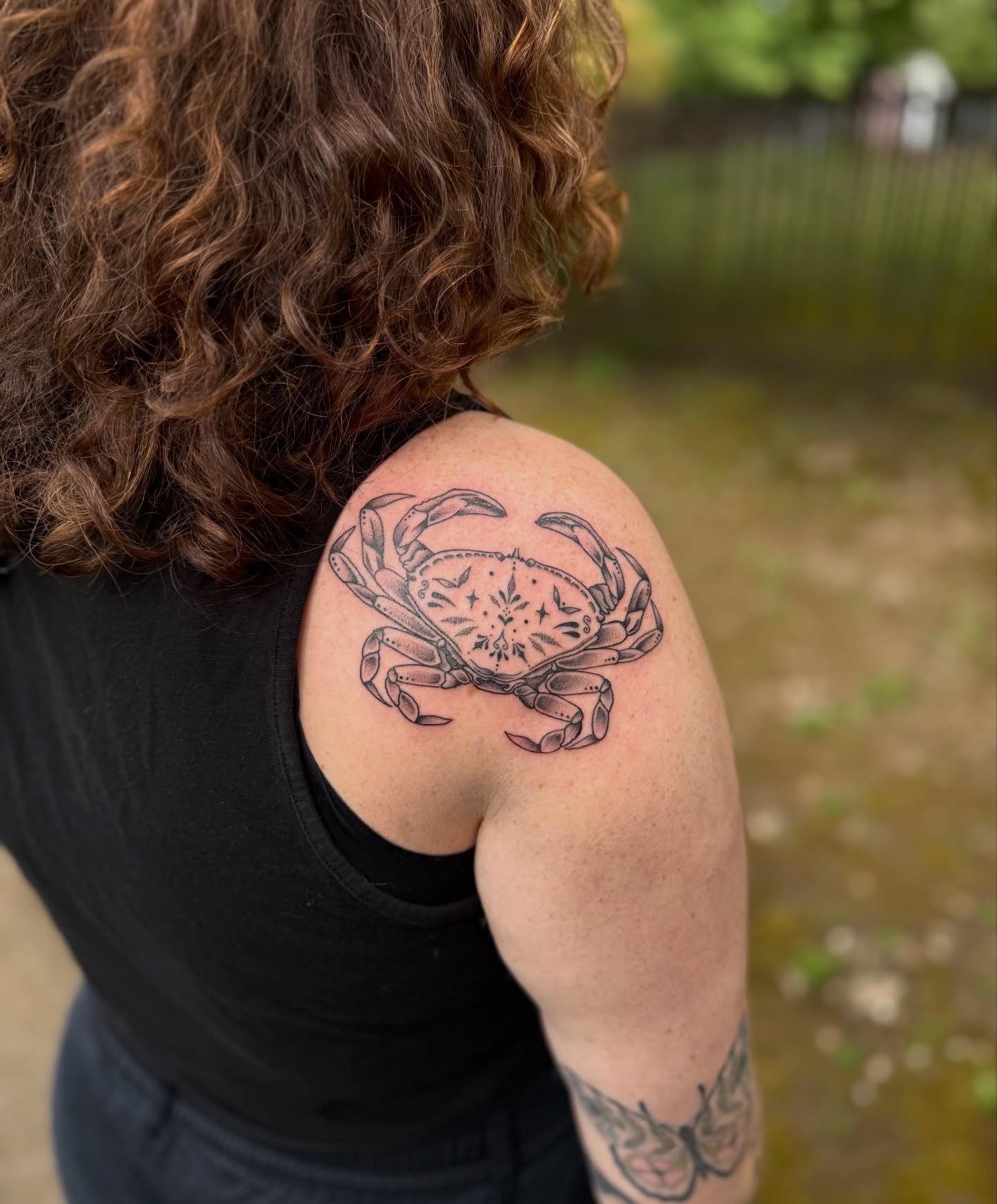 Crab black and grey tattoo on the shoulder by Jenna Nicole