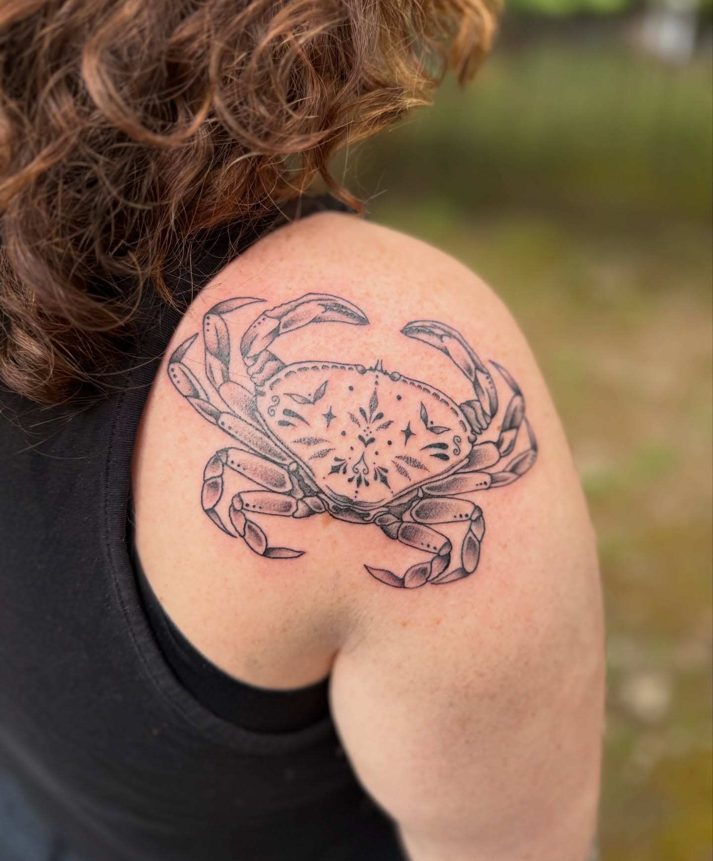 Crab black and grey tattoo on the shoulder by Jenna Nicole