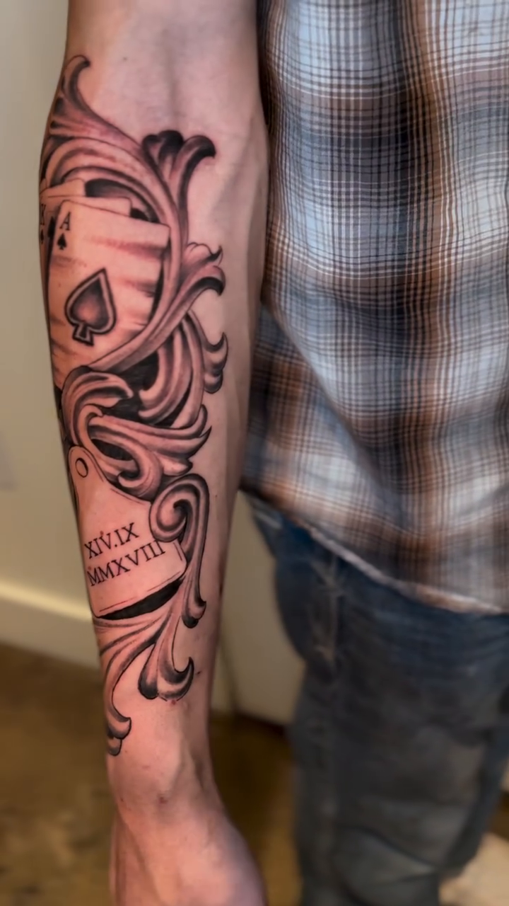 Playing cards and scrollwork Chicano tattoo by Matthew Crawley