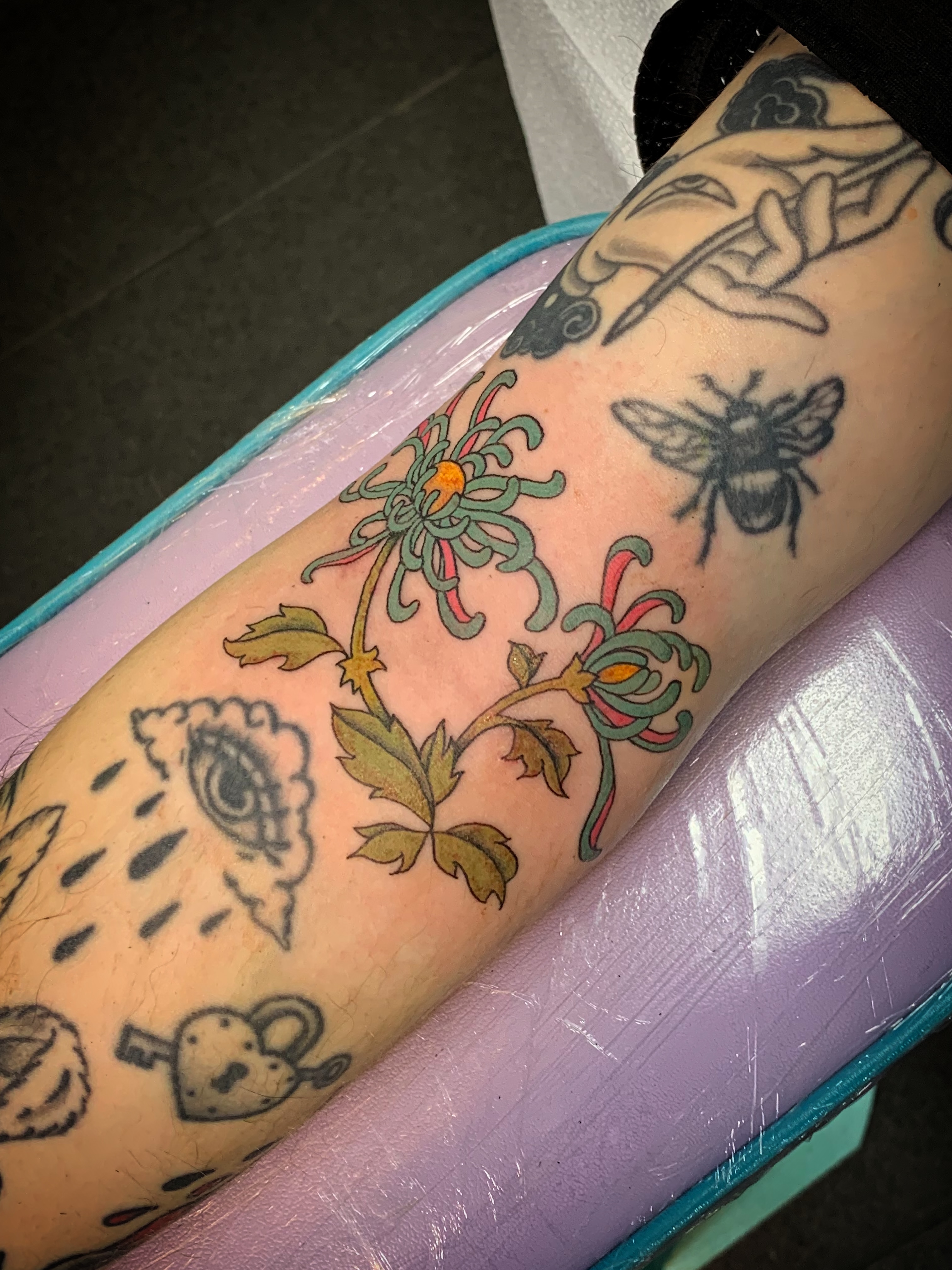 Floral arrangement American traditional tattoo on the forearm by Laura