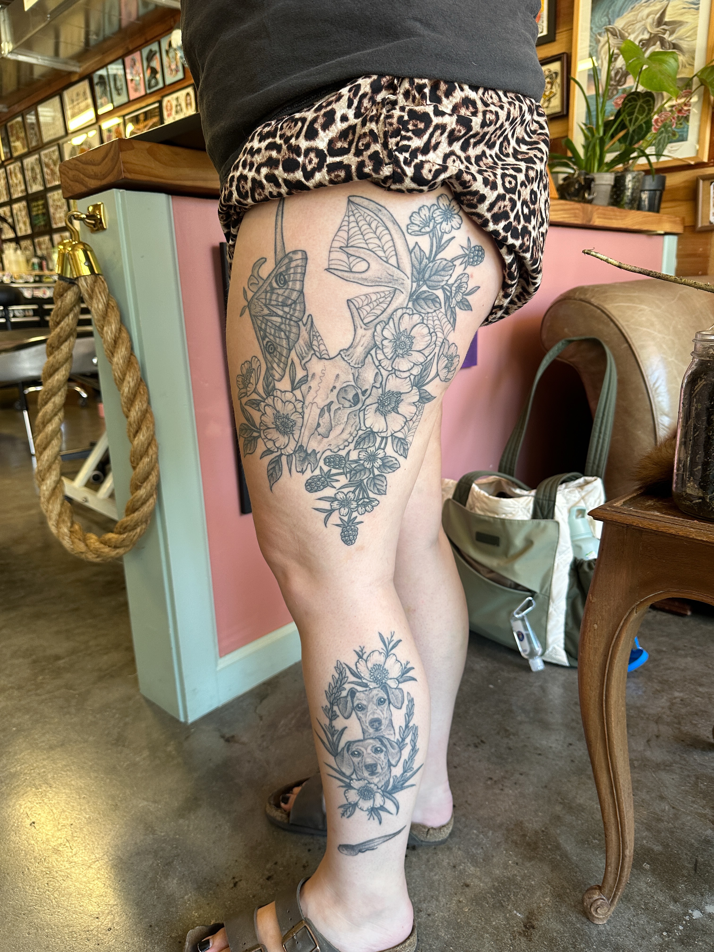 Floral and animal motifs black and grey tattoo on the thigh by Tattooing by Patty Valentine