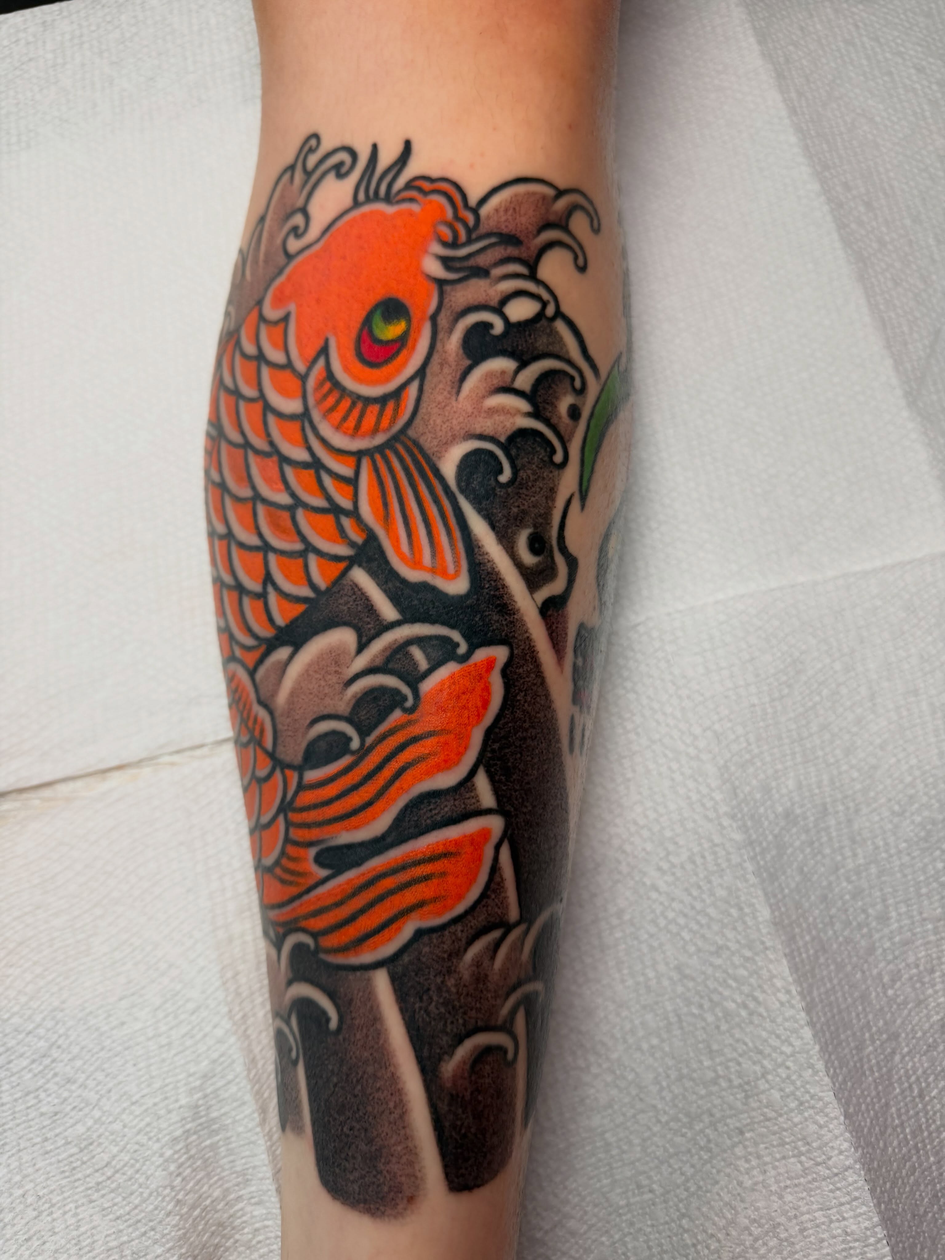 Koi fish japanese irezumi tattoo on the forearm by Don Lee