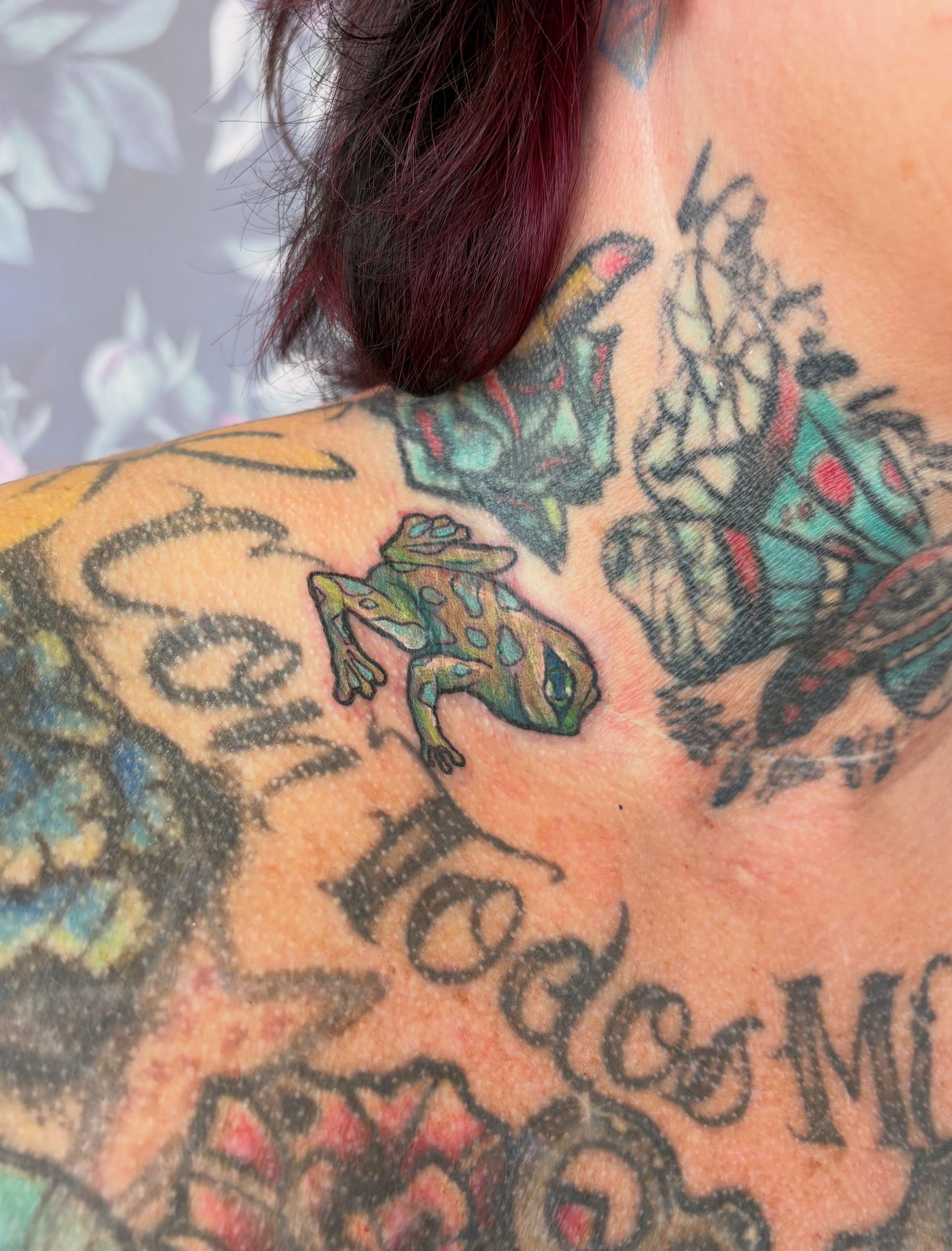 Frog new school tattoo on the neck by Bre Alex