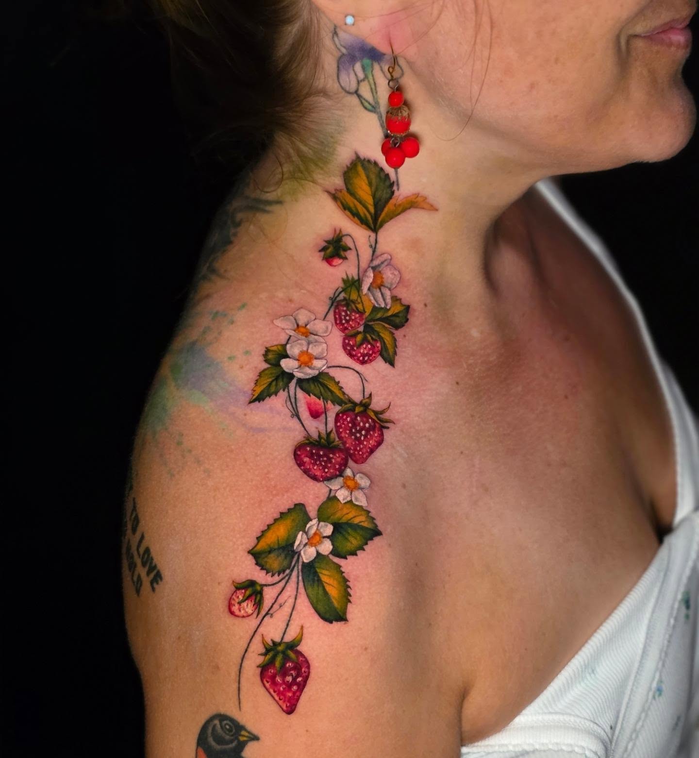 Strawberry vine realism tattoo on the shoulder by Banana Cake
