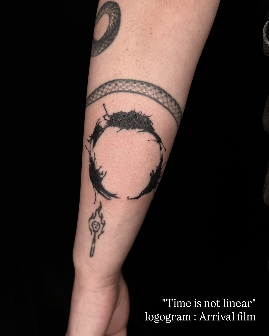 Logogram and matchstick blackwork tattoo on the forearm by ๐๐ฆ๐ฐ๐ฆ๐