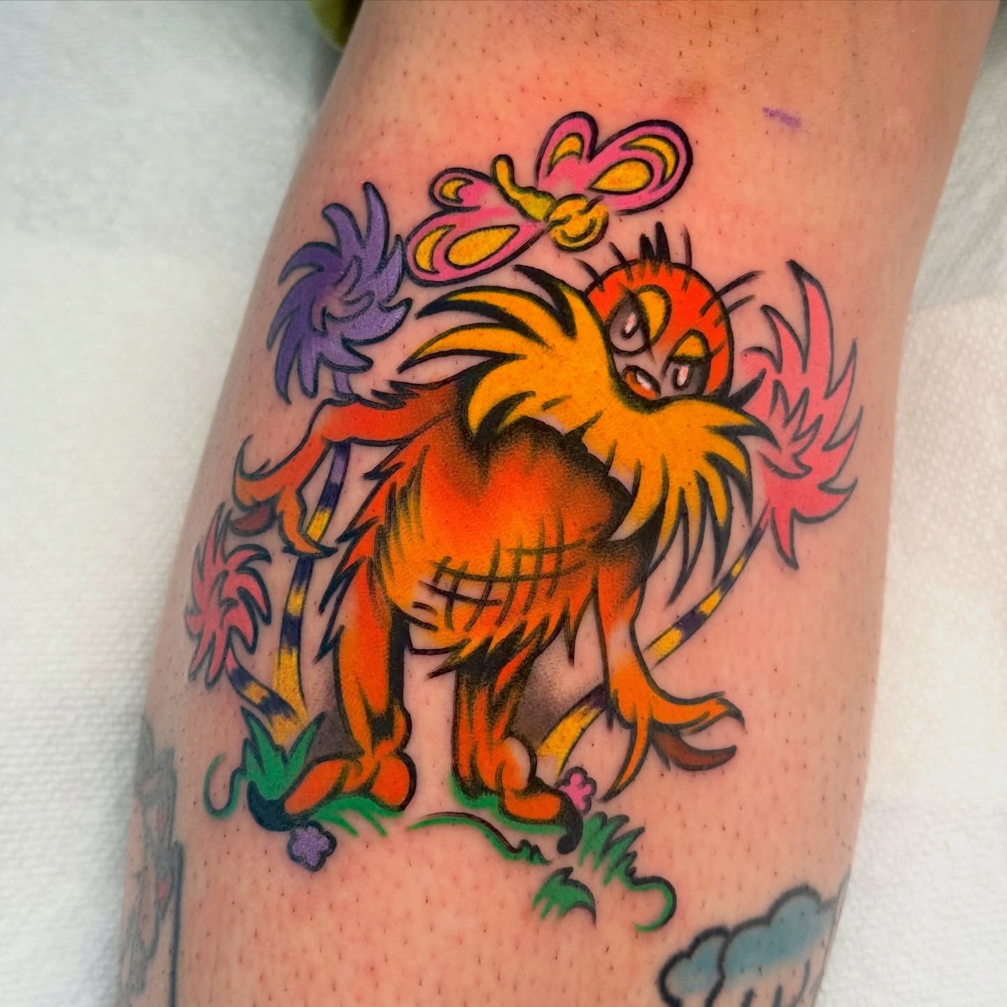 Lion new school tattoo on the forearm by sydtatz