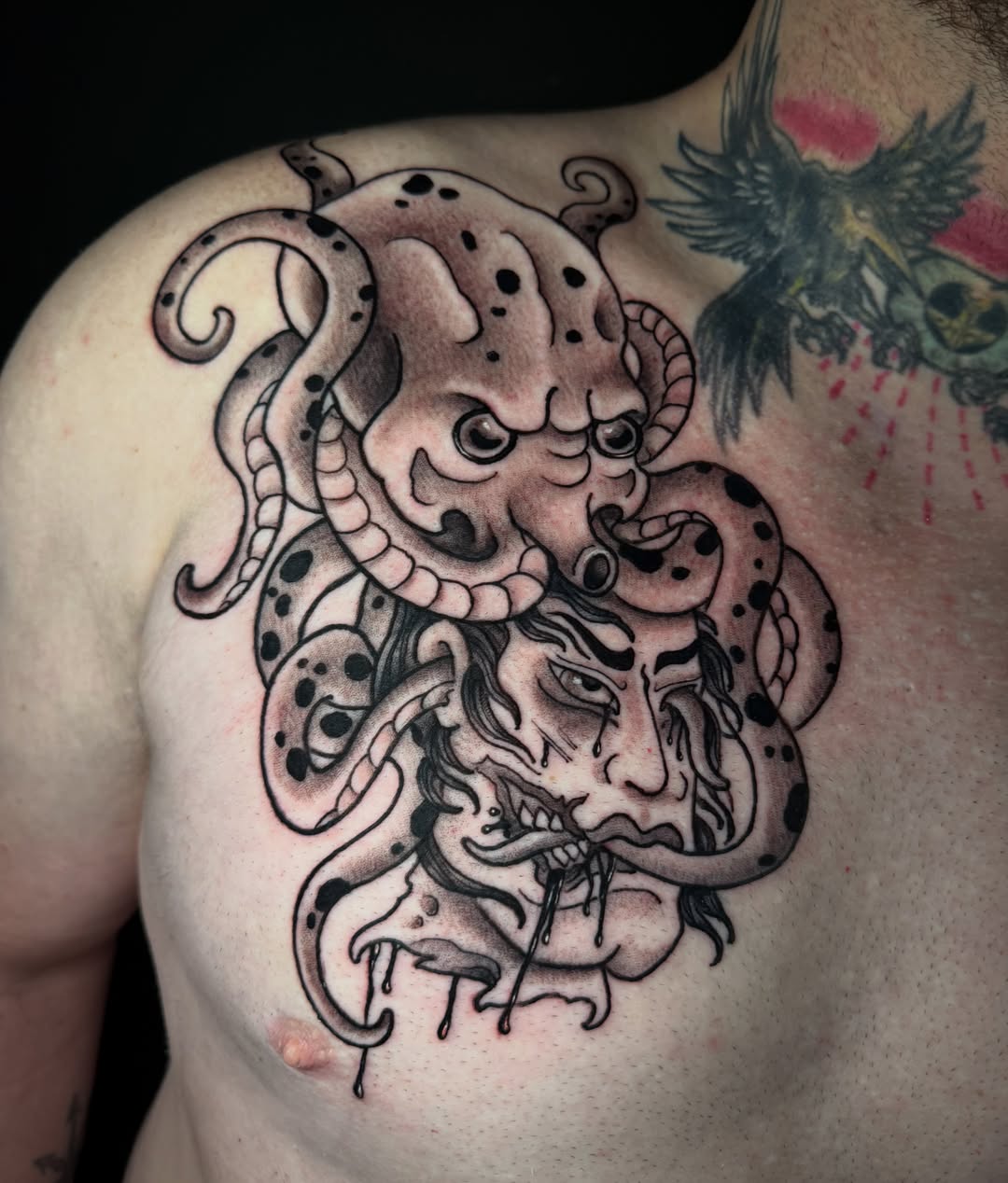 Octopus and man American traditional tattoo on the chest by Dee Florian