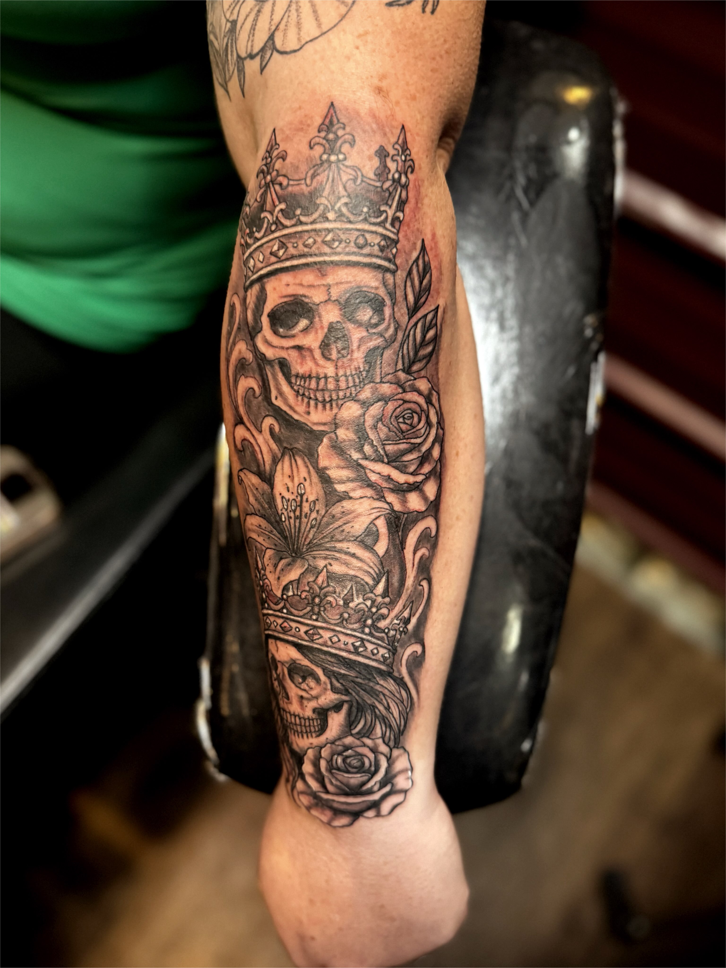 Skull and roses realism tattoo on the forearm by Chris Adkins Tattoos, Chattanooga, Tennessee