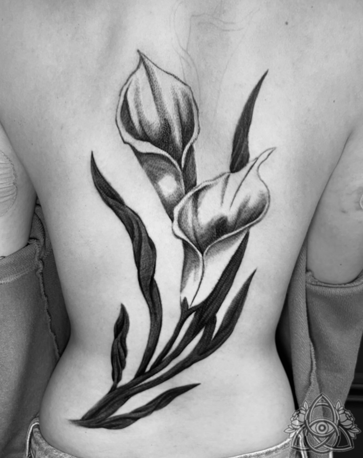 Calla lilies realism tattoo on the ribs by Michael - Tattoo Garden Everett, Everett, Washington