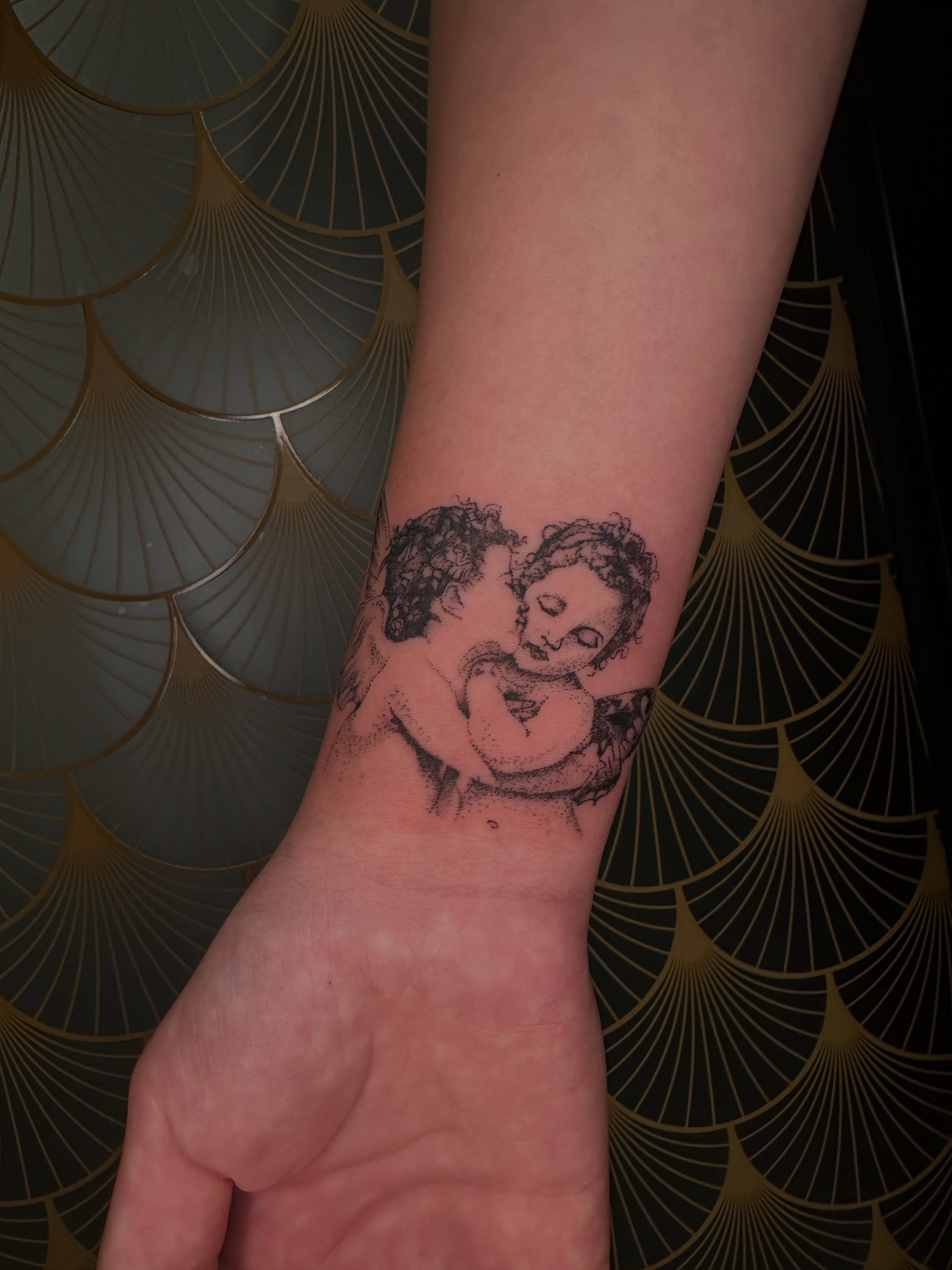 Two cherubs realism tattoo on the forearm by ⊹₊⟡⋆ 𝕵𝖔𝖎𝖊 ⊹₊⟡⋆