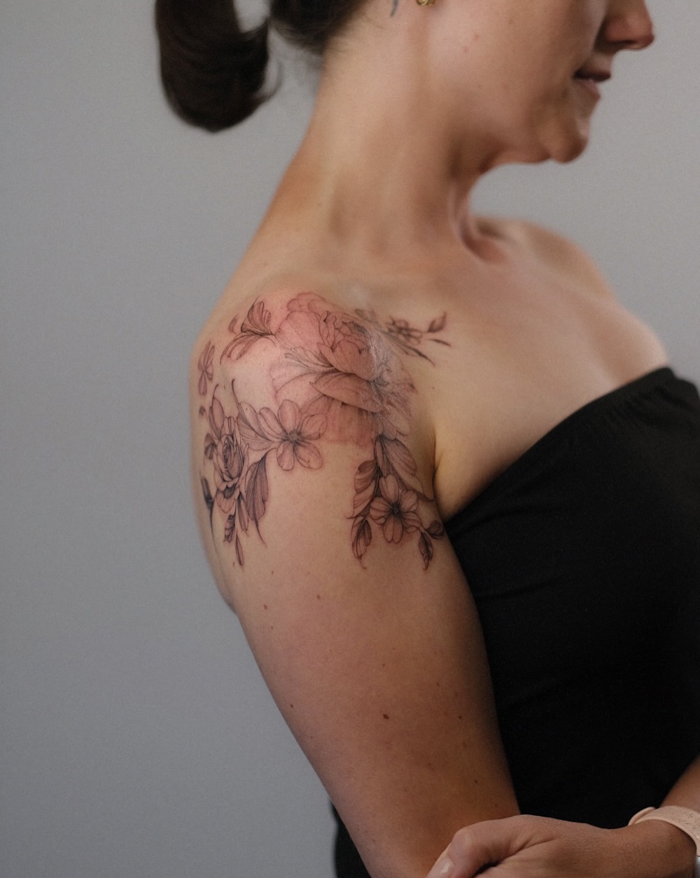 Floral arrangement dotwork tattoo on the shoulder by Temple Adorned Tattoo