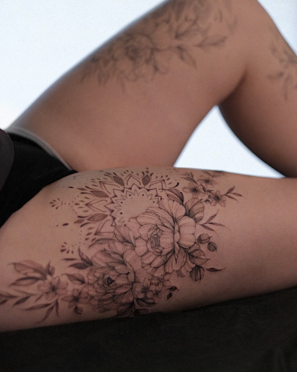 Floral bouquet black and grey tattoo on the forearm by Temple Adorned Tattoo