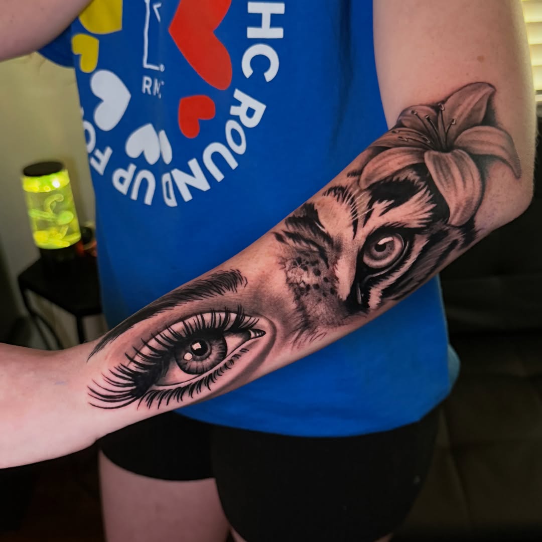 Eye and cat realism tattoo on the forearm by Quentin Stevenson, Slidell, Louisiana