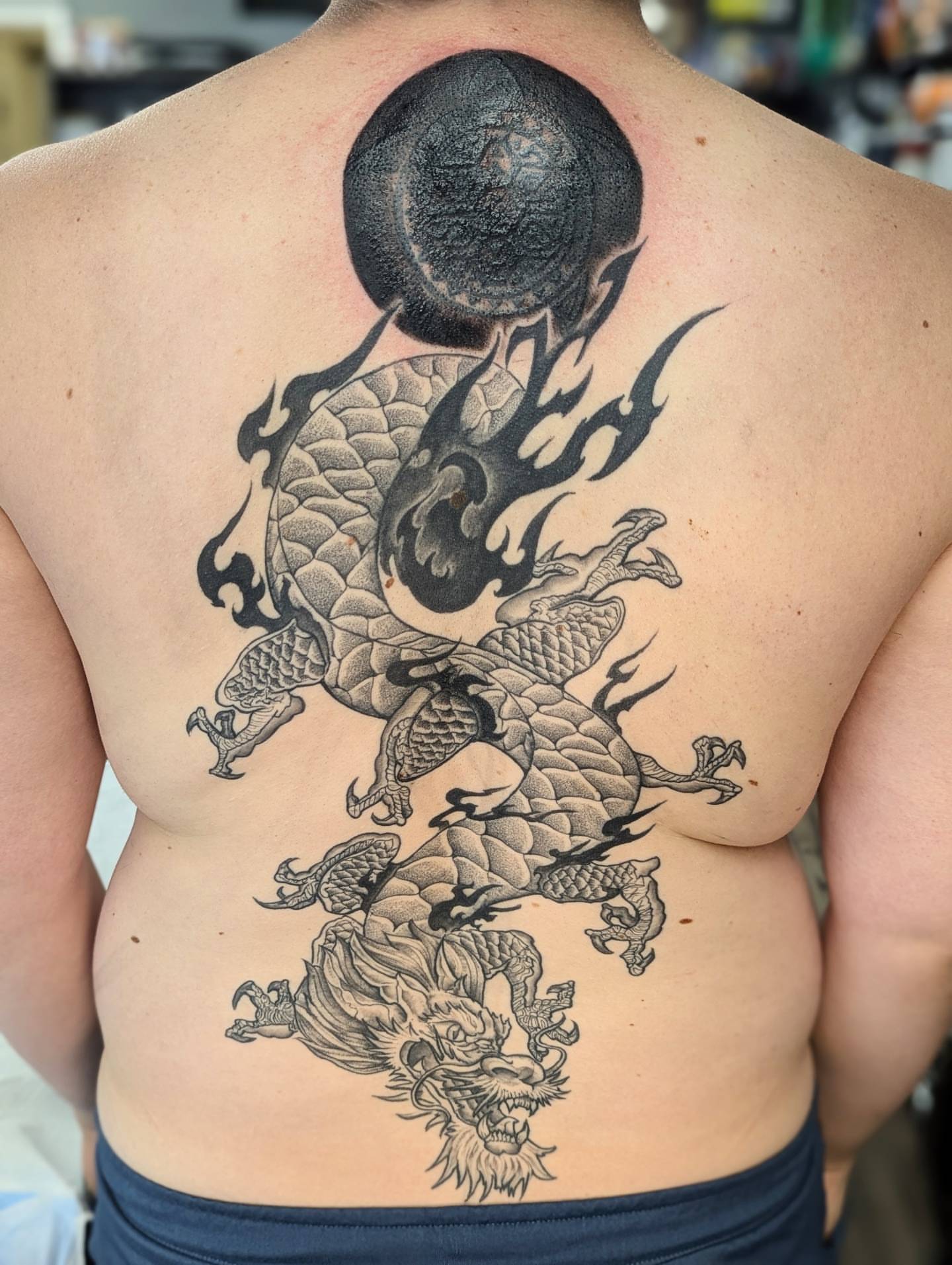 Dragon and yin yang dotwork tattoo on the back by DONEL 📍Denver