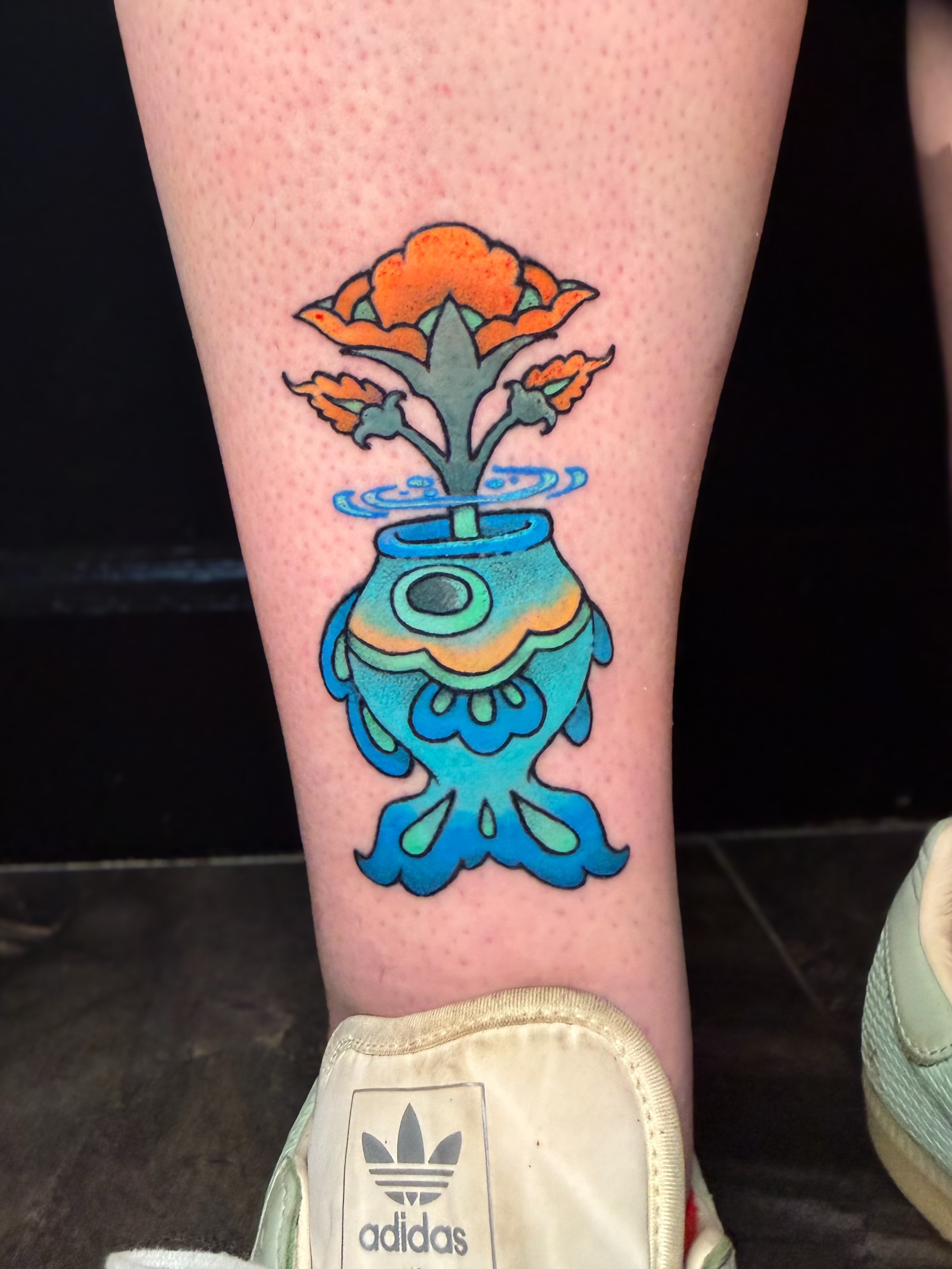 Flower pot new school tattoo on the calf by Ivy-Jade Edwards, Memphis, Tennessee