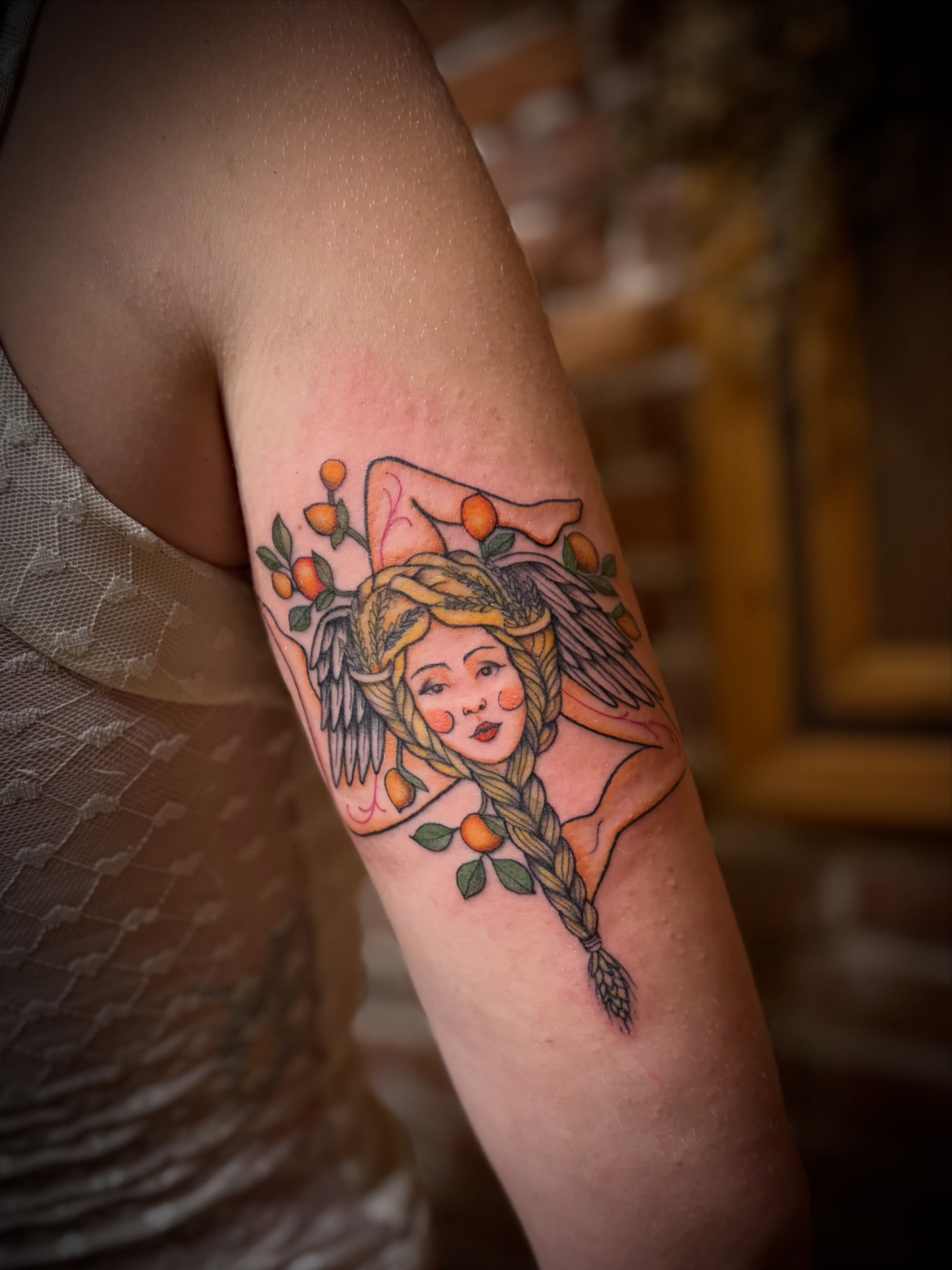 Woman with wings neo-traditional tattoo on the forearm by Tattoo Artist, Kansas City, Missouri