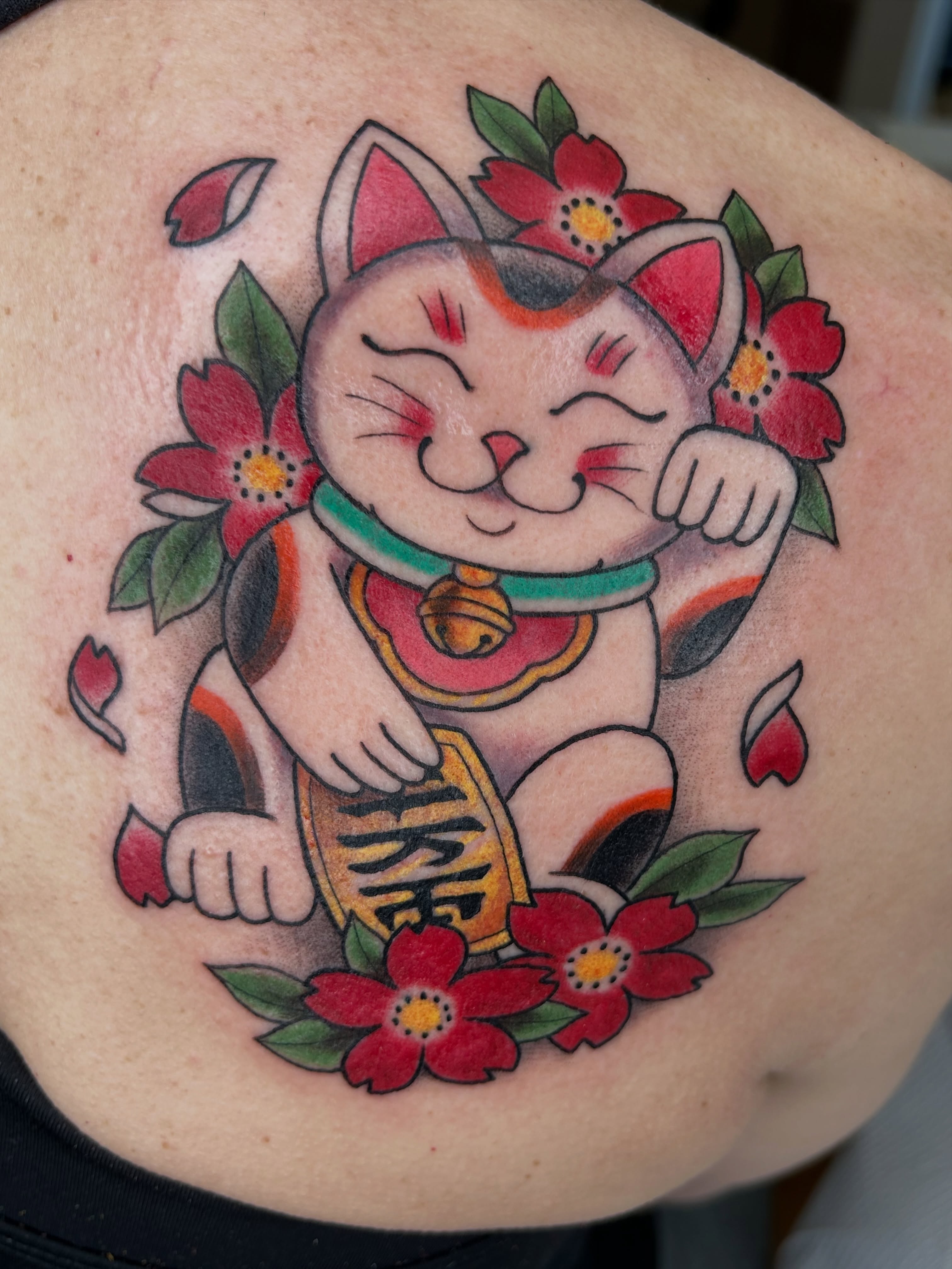 Lucky cat American traditional tattoo on the shoulder by Alex Byrne