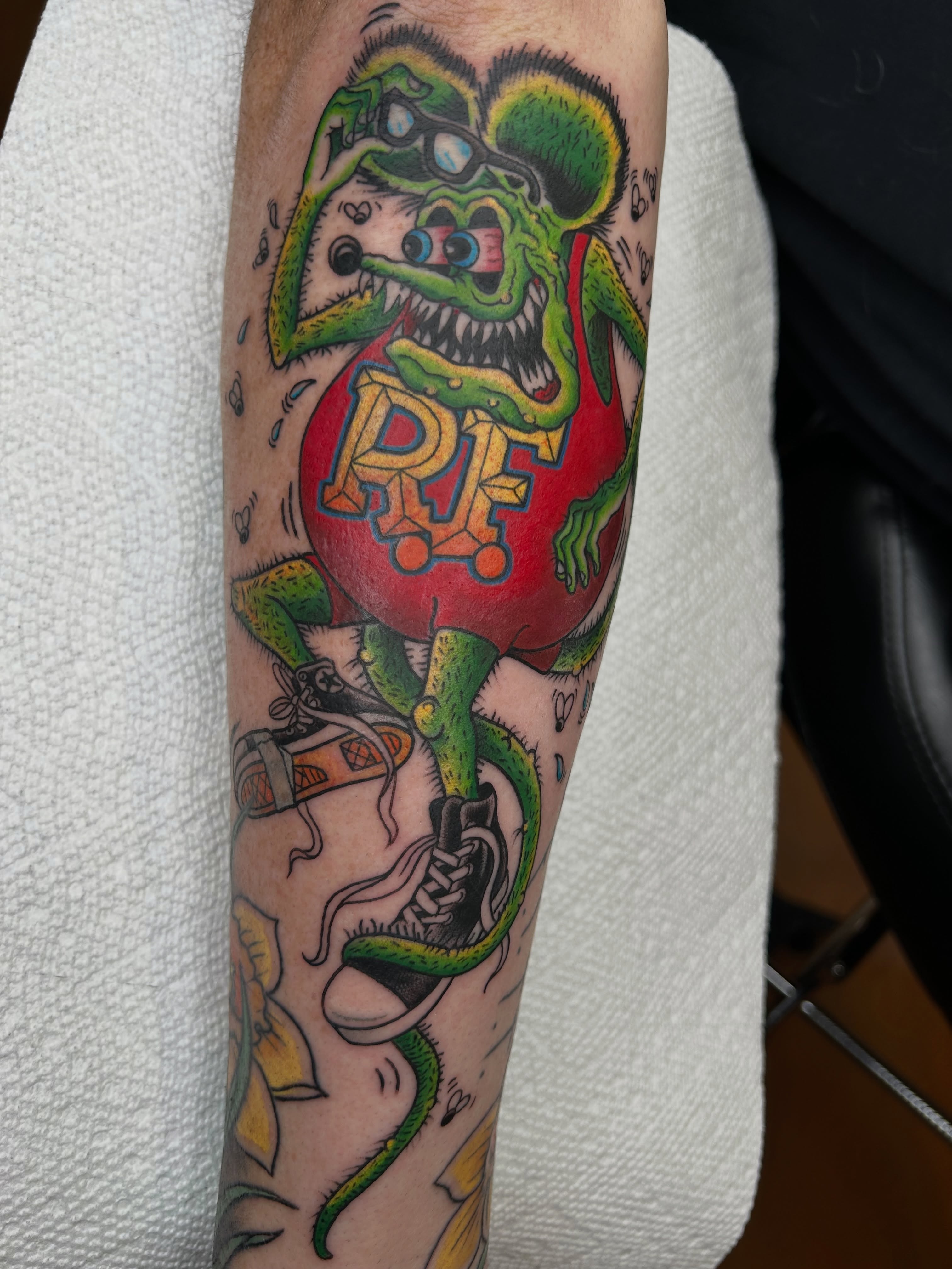 Ghoul with sneakers American traditional tattoo on the forearm by Alex Byrne