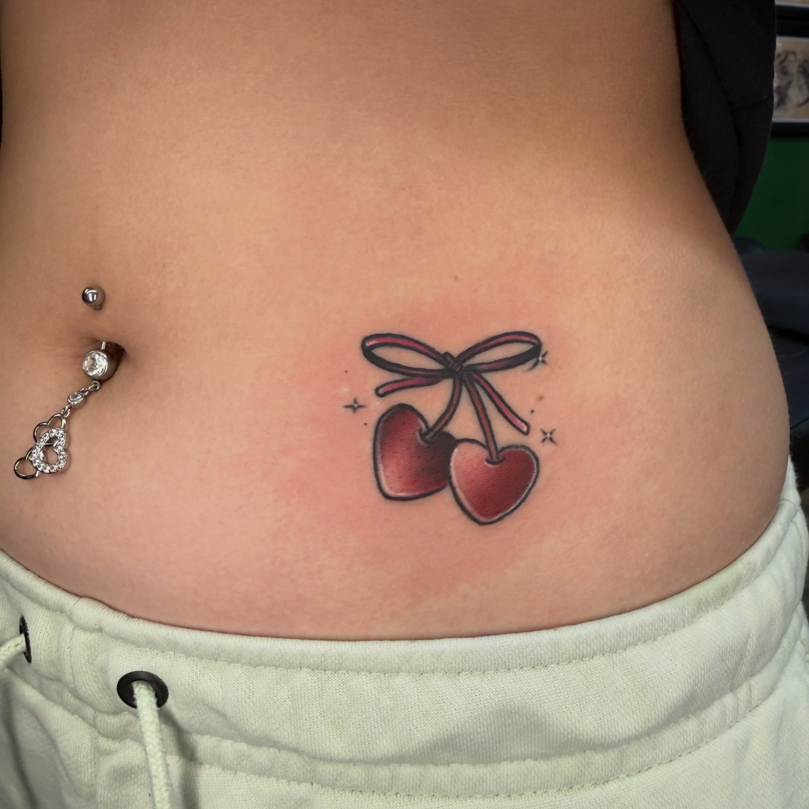 Cherry pair realism tattoo on the torso by Josh Roberts, Franklin, Ohio