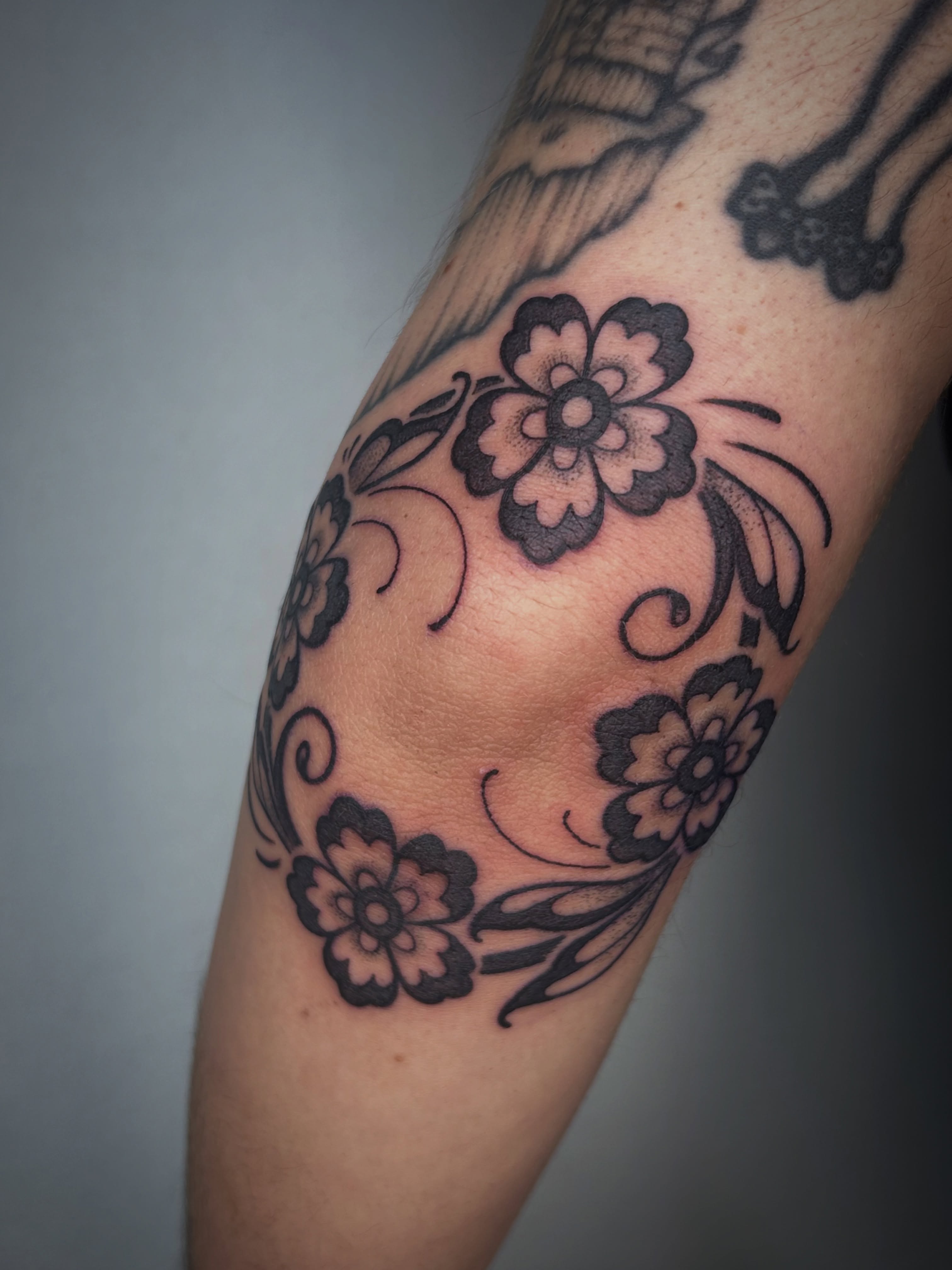Floral design black and grey tattoo on the forearm by Aaron Murray ✨ Michigan Tattoo Artist