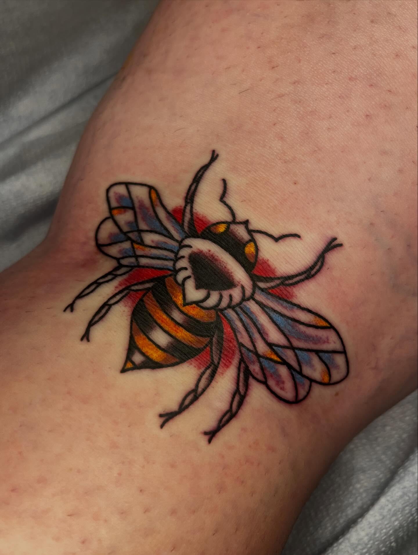 Bee American traditional tattoo on the forearm by monk