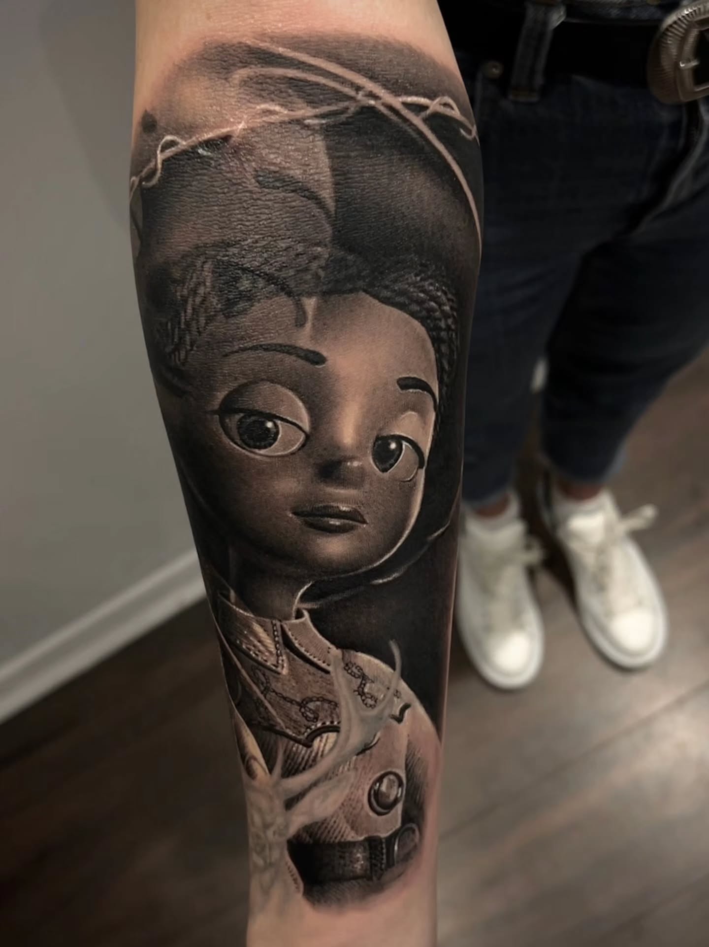 Child portrait realism tattoo on the forearm by Owen Paulls
