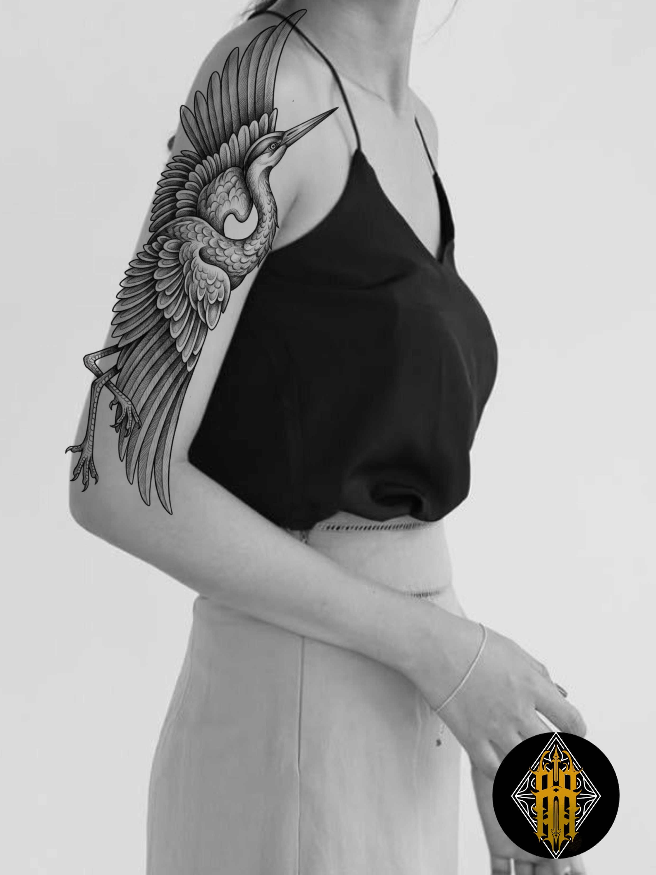 Heron black and grey tattoo on the upper arm by Rafael Alfredo Armas Hoyos, Salt Lake City, Utah