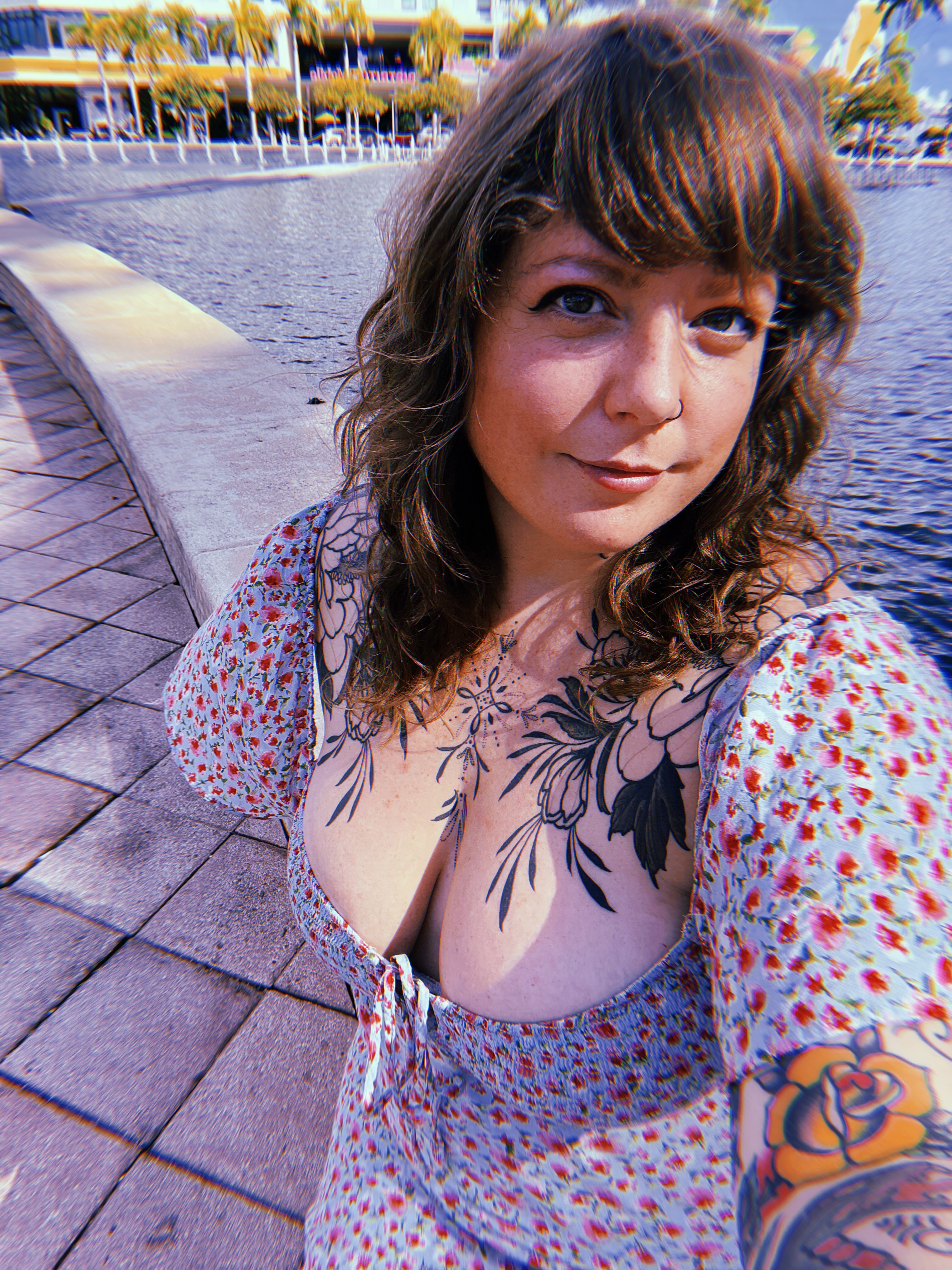 Floral American traditional tattoo on the chest by Kat Ackerman