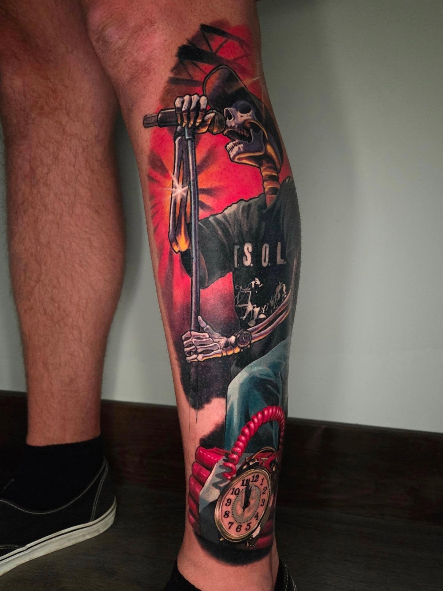 Skeleton with microphone realism tattoo on the calf by Preston