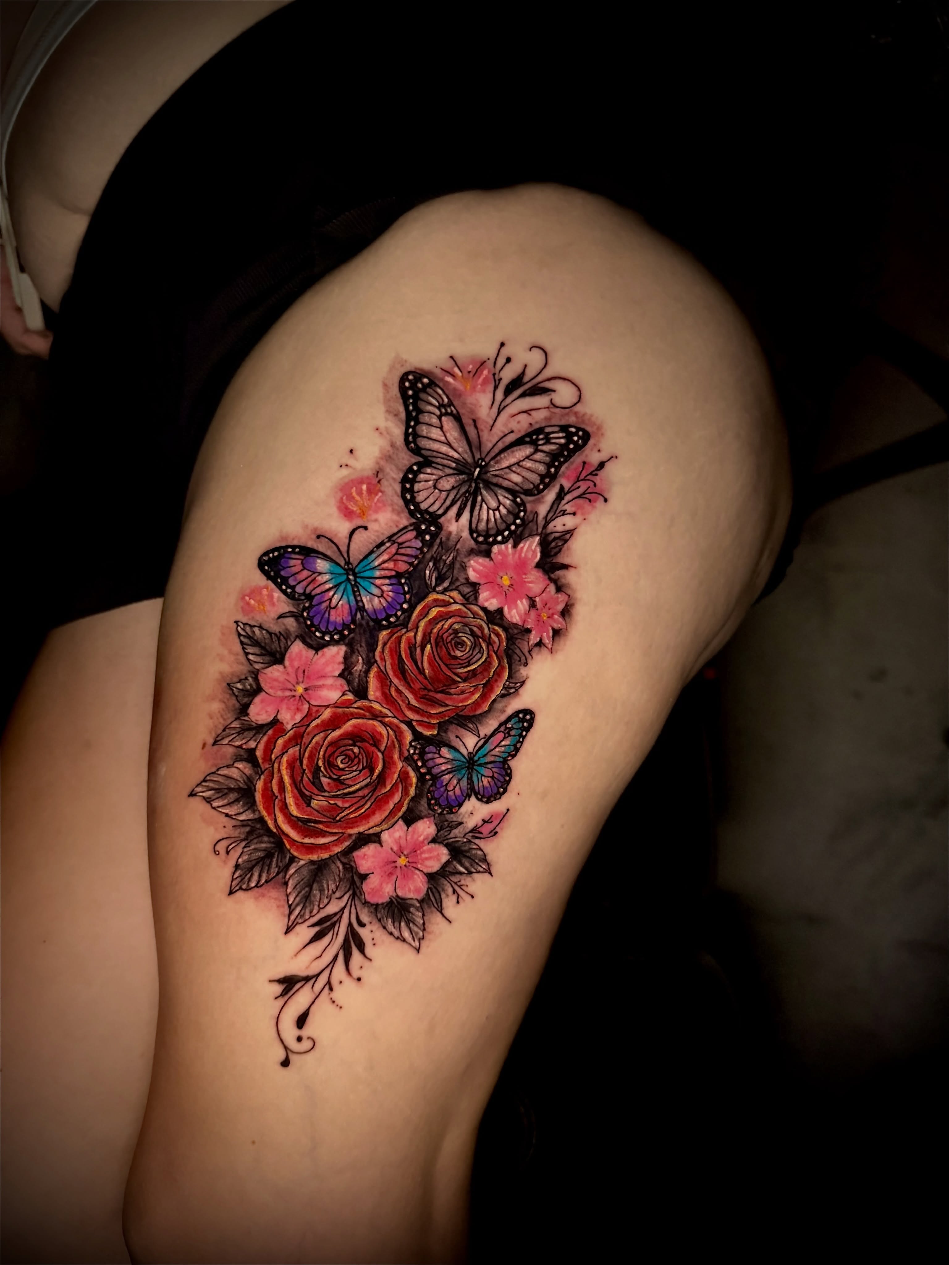 Butterflies and roses realism tattoo on the thigh by Junior Sanchez Dfw