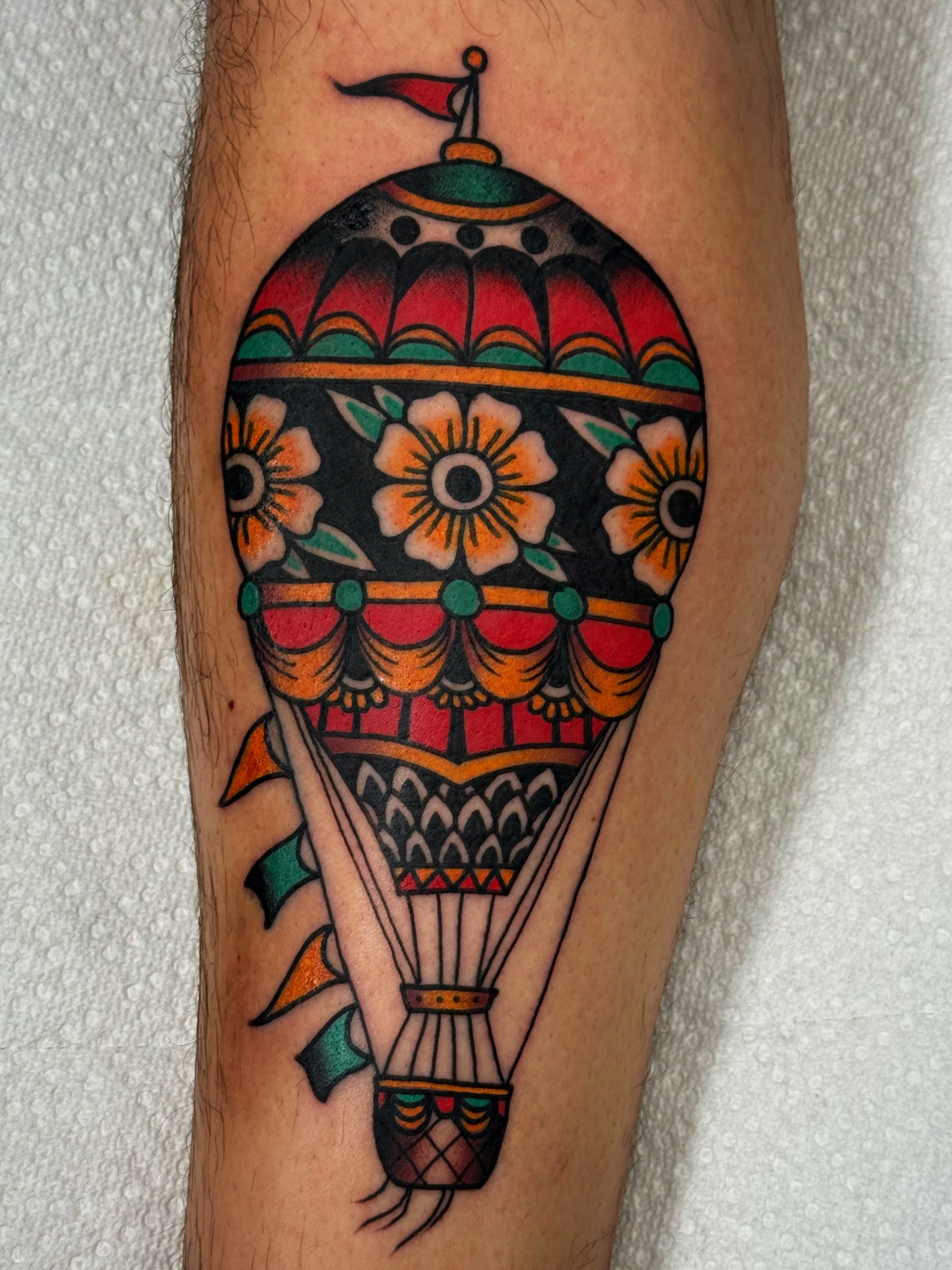 Hot air balloon American traditional tattoo on the forearm by Mikey Sarratt